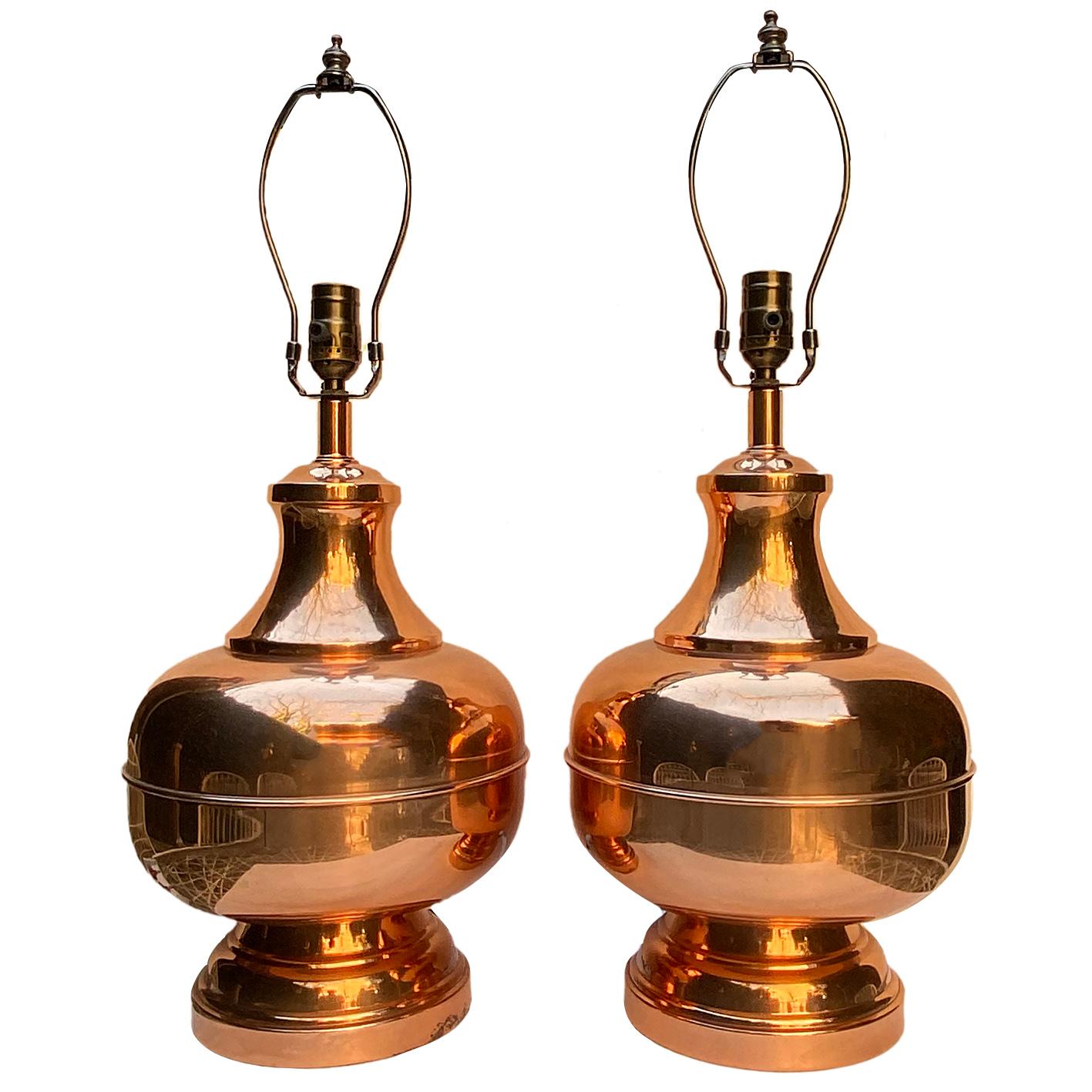 Pair of circa 1960's English copper table lamps with polished finish.

Measurements:
Height of body: 14