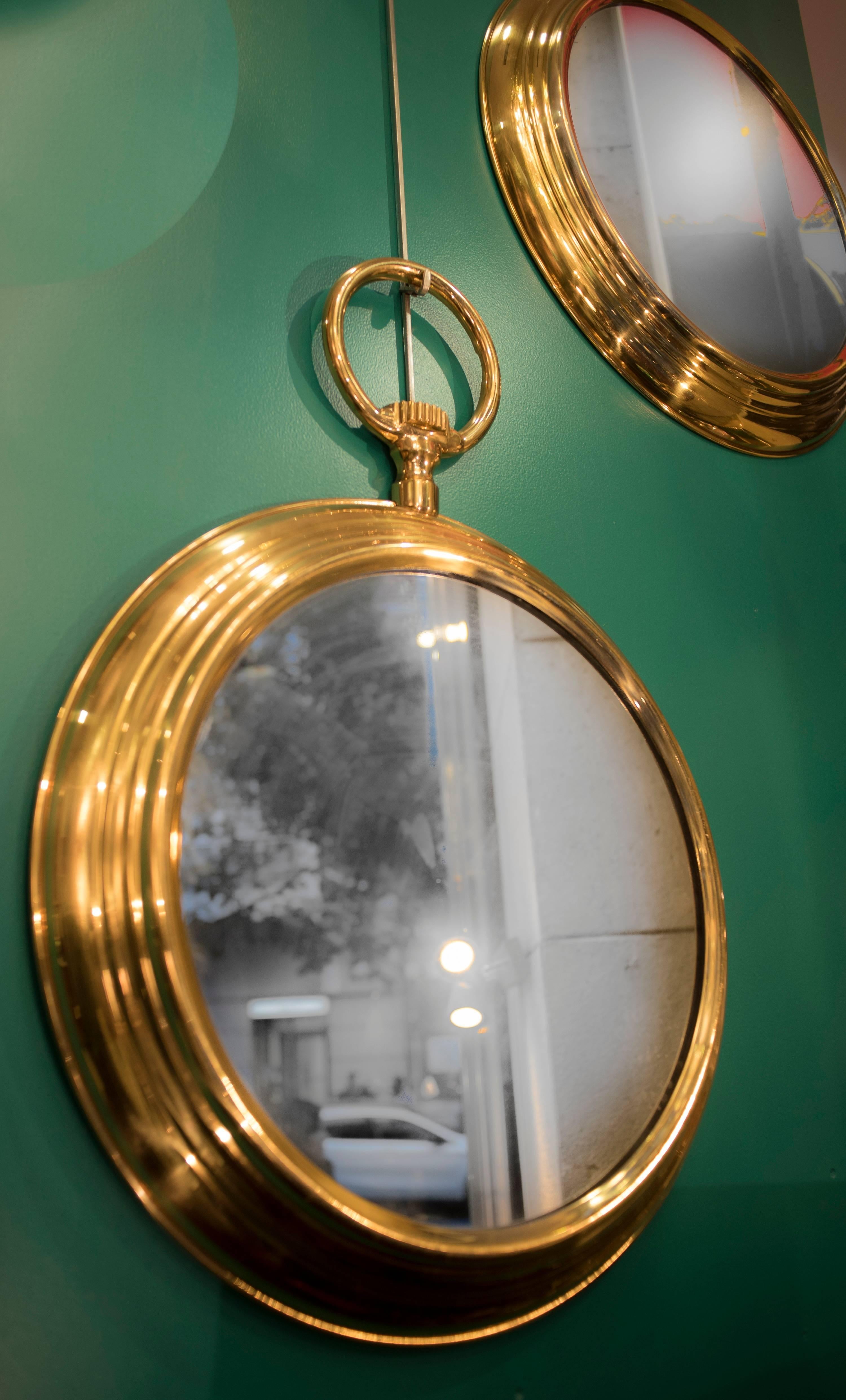 Amazing couple of watch mirrors in bright bronze, midcentury, circa 1960. Free shipping