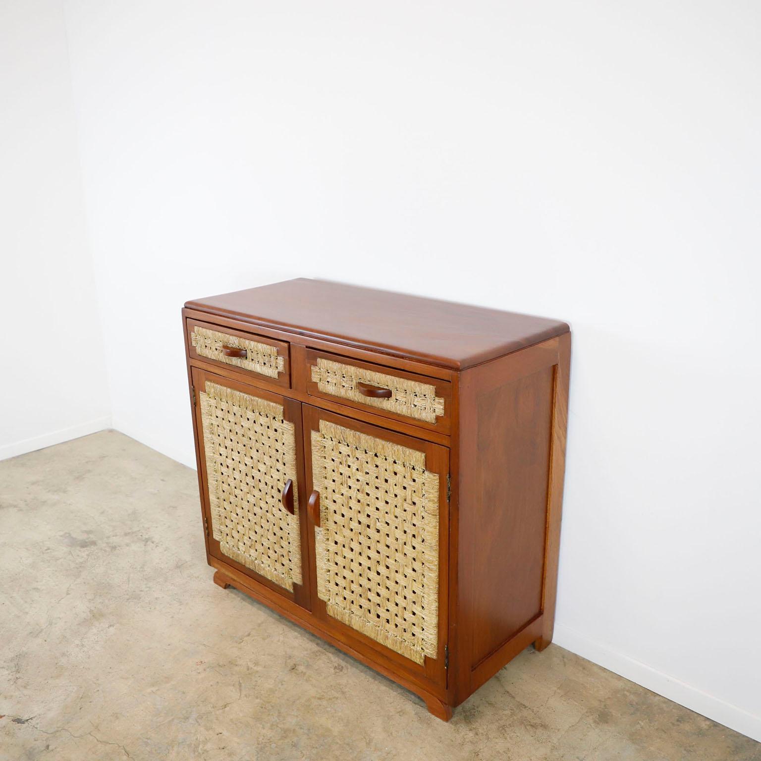 We offer this midcentury Credenza in the style of Clara Porset made in solid wood and palm cords, circa 1960. Great vintage condition. The wood has been professionally refinished.