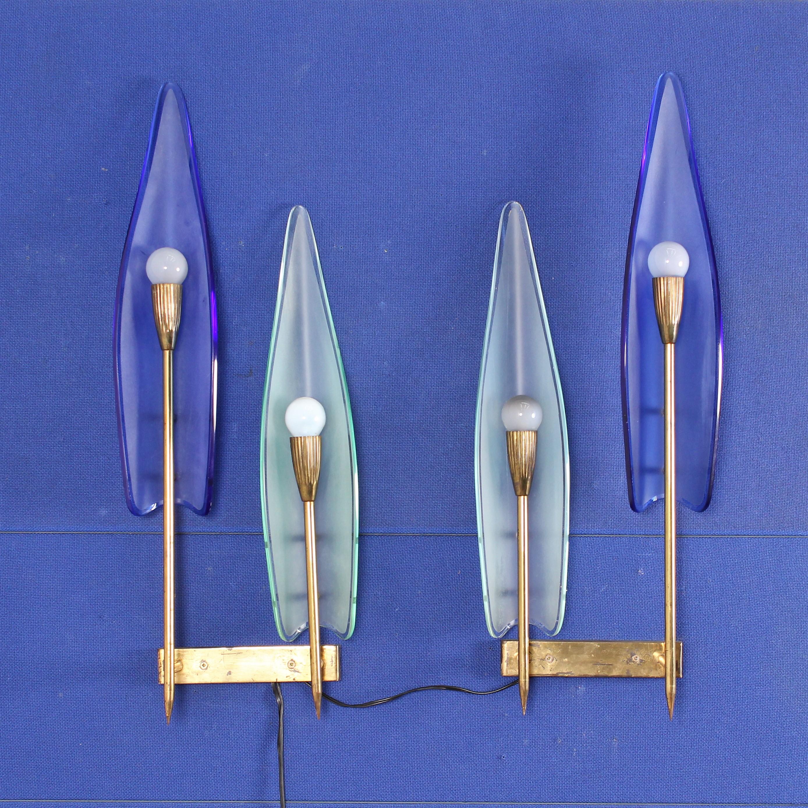 Pairs of big and beautiful sconces by crystal Art, Italy, late 1950s.
Light blue colored flower-shaped curved glasses with brass structure.

Wear consistent with age and use.

   