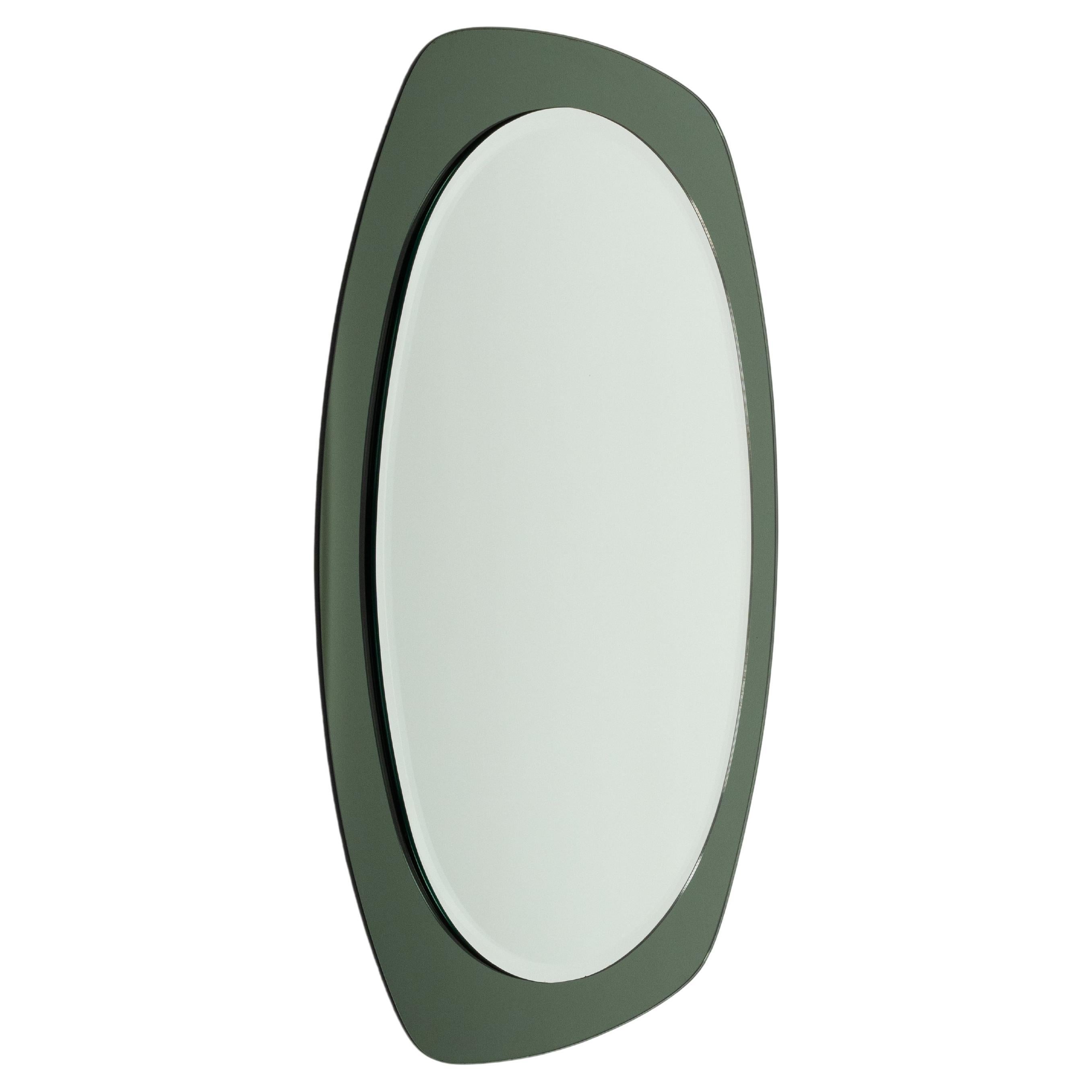 Midcentury beautiful double-level  oval wall mirror with a smoked green glass frame attributed to Cristal Art.

Made in Italy in the 1960s.