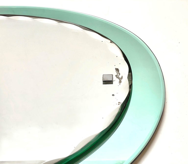 Mirror Mid-Century Italian Cristal Arte carved oval mirror, framed, Italy 1960s For Sale