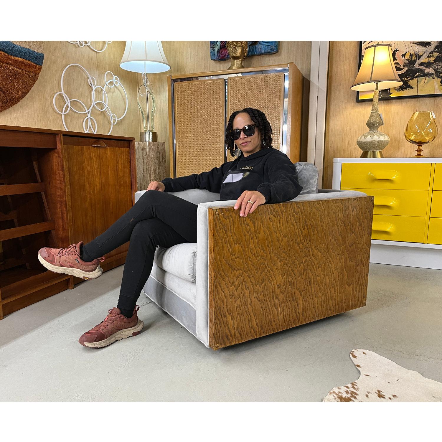 This 1970s Cubist club chair is stately, broad, heavy, masculine and sturdy. The deep seats and thick cushions aid in comfort while providing a high seat height. Crafted in the style of esteemed designer Milo Baughman. The chair has been restored