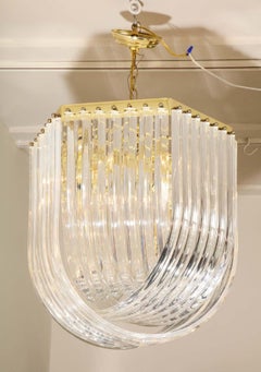 Midcentury Curved Lucite Ribbon Chandelier in Brass