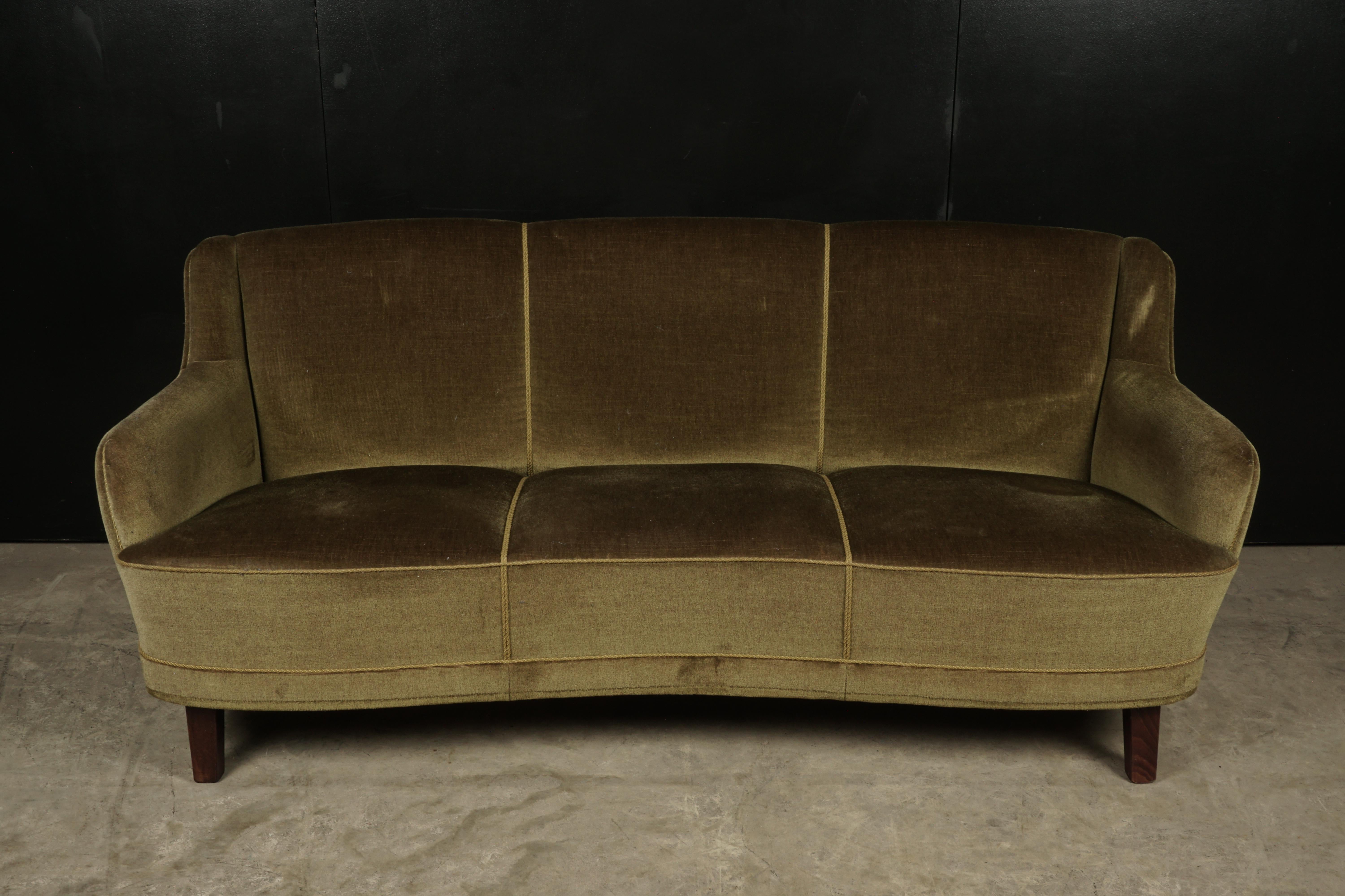 Midcentury curved sofa from Denmark, circa 1950. Original green velour upholstery.