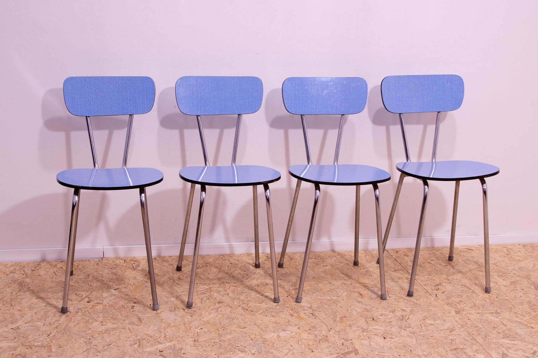 Mid-century color formica cafe or dining chairs with chrome legs. They were made by Kovona company in the former Czechoslovakia in the 1960’s. In good Vintage condition, shows signs of age and using. Price is for the set of 4.

Height: 80 cm

Width: