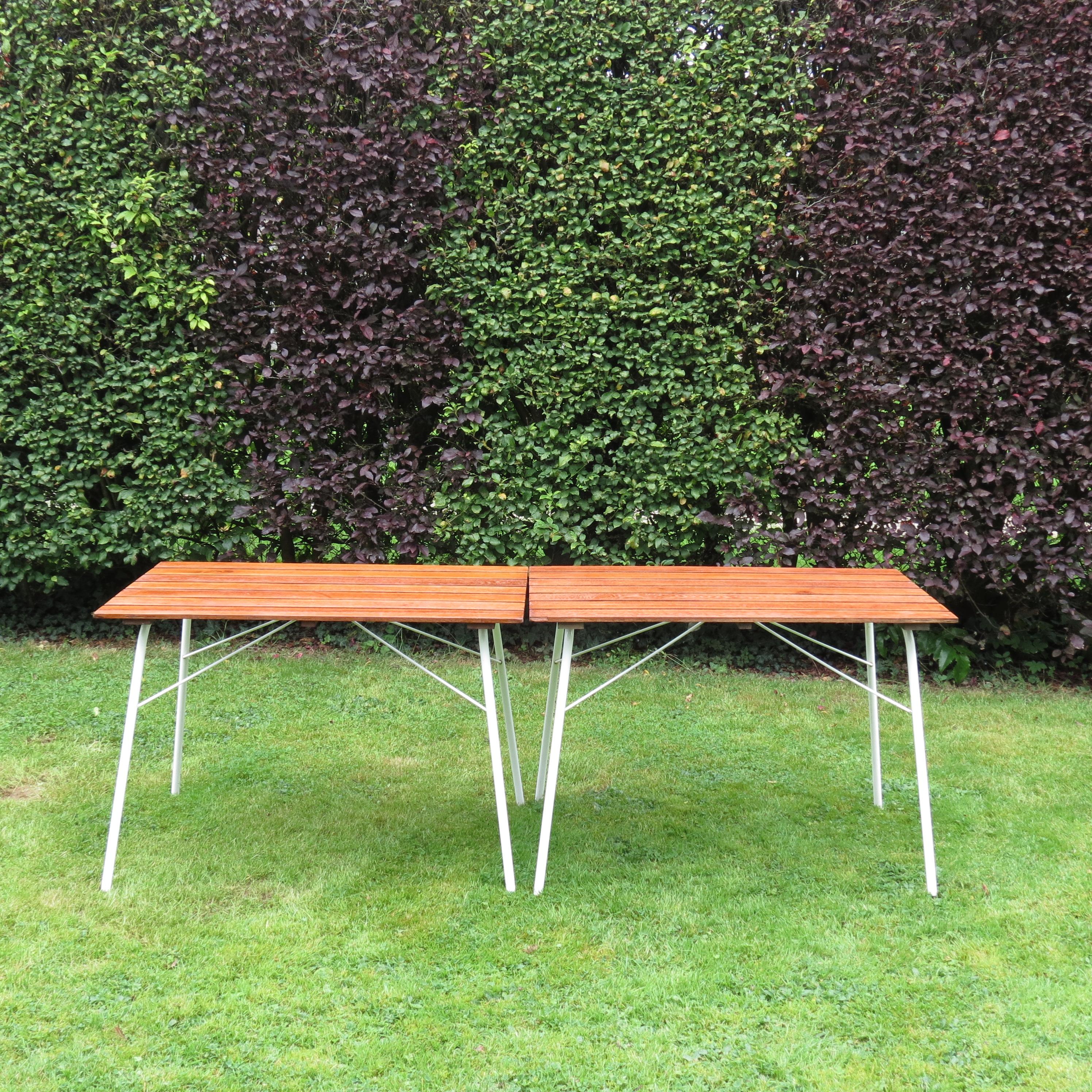 Wonderful folding garden table, designed and produced by Daneline, Denmark.

Plastic coated steel tube frame with solid Teak slatted top. The table legs fold away when not in use for ease of storage.

Dating from the 1960s,  in good condition, with