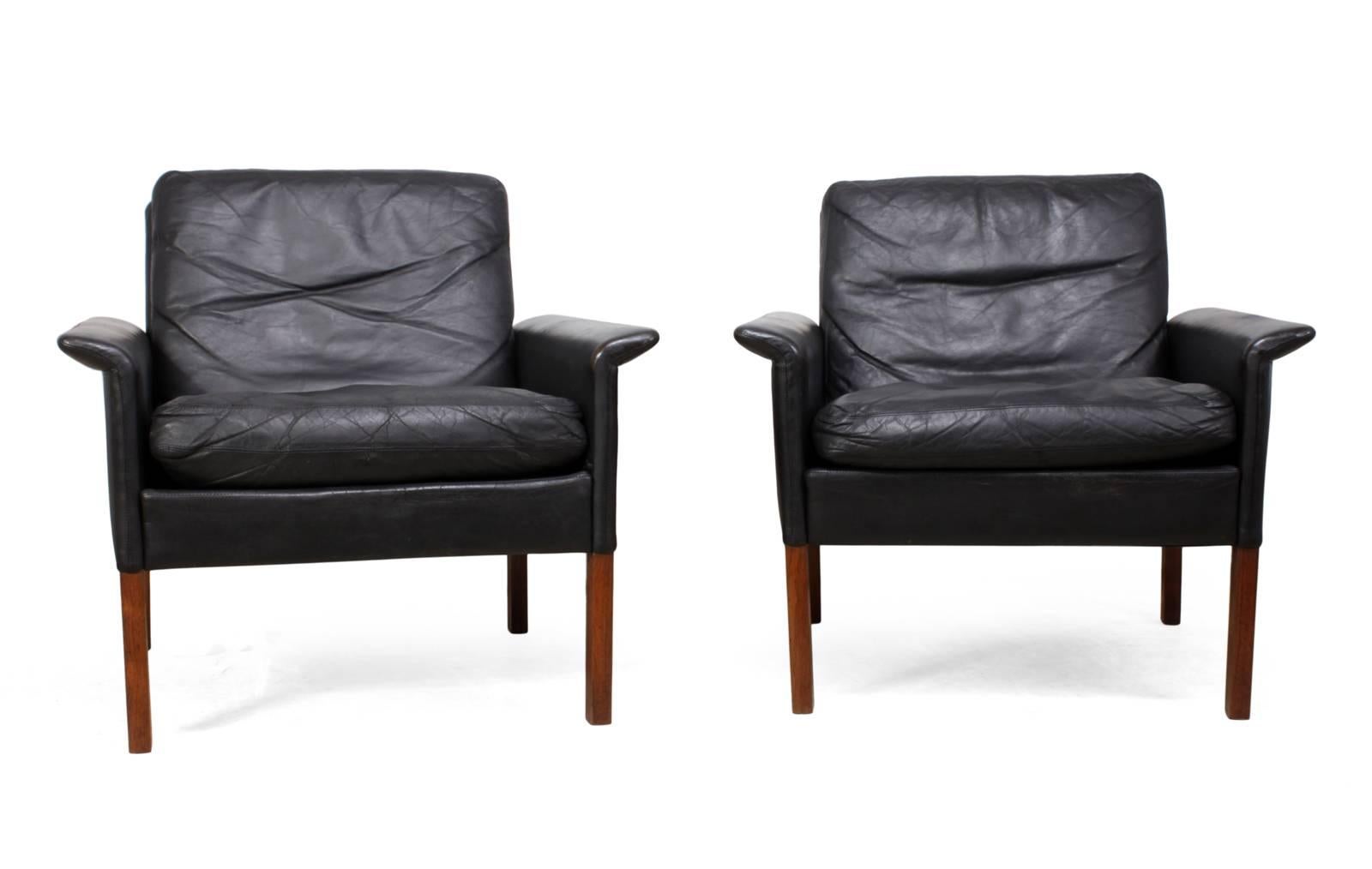 Midcentury Danish armchairs by Hans Olsen
This pair of Danish chairs were designed by Hans Olsen in the late 1950s, they have black leather upholstery with down filled cushions, the legs are solid rosewood and frames are solid beech, the leather