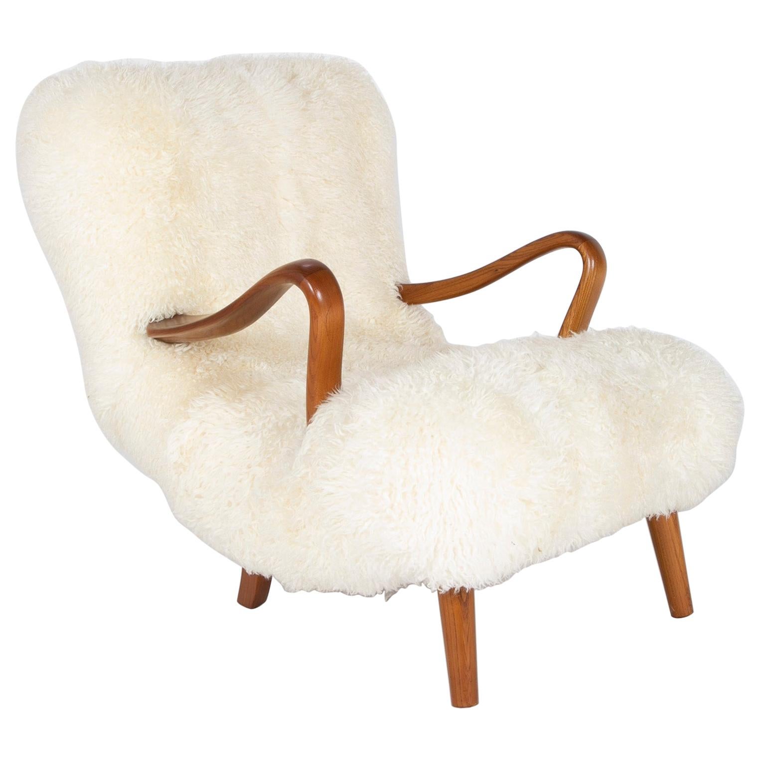 Midcentury Danish Chair of Elm Wood and Sheepskin in the Style of Arctander