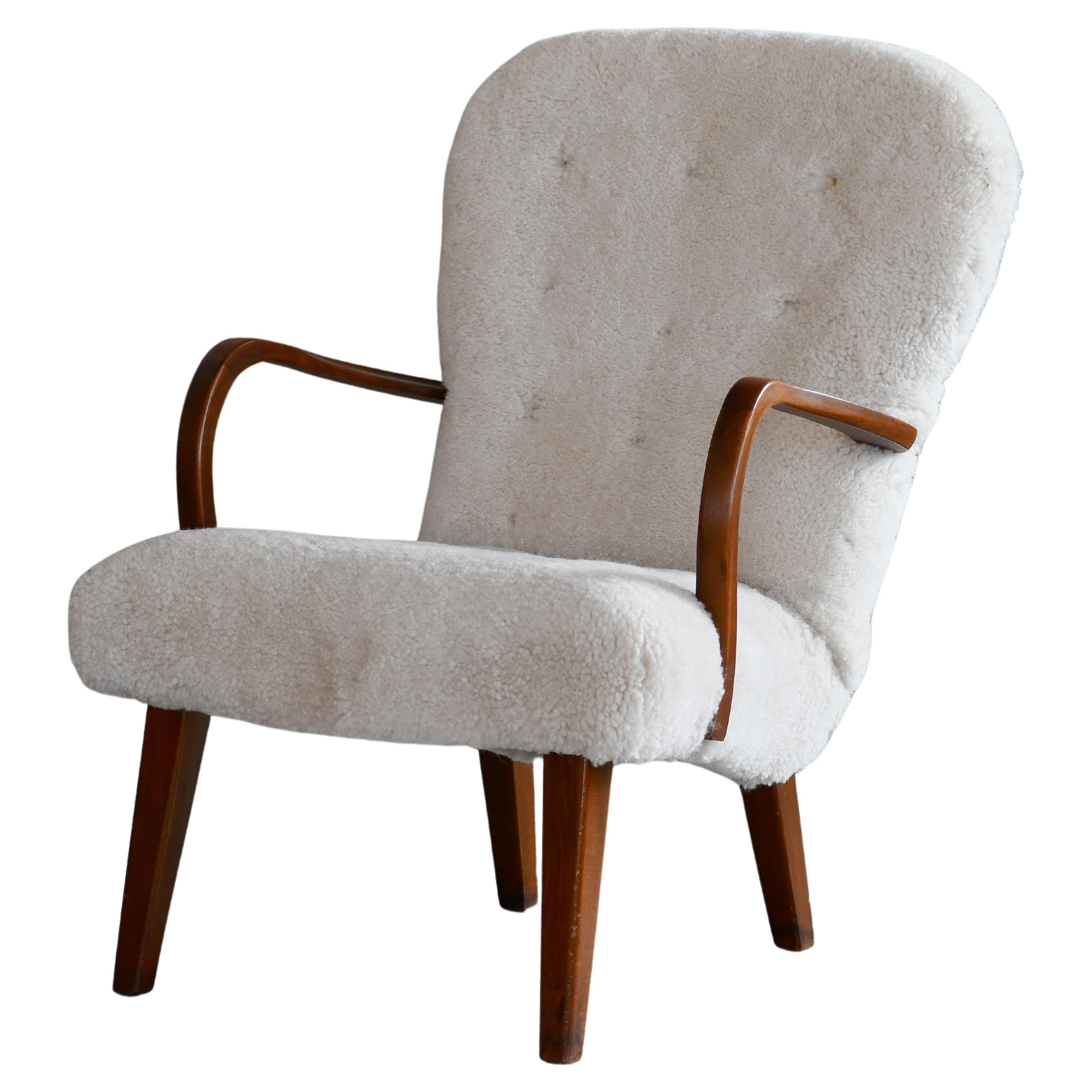 Midcentury Danish Clam Style Lounge Chair in Luxurious Sheepskin, 1950s For Sale