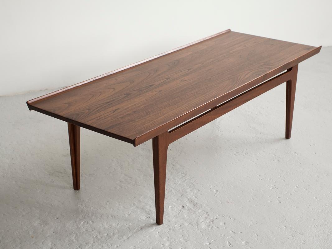 Midcentury coffee table designed by Finn Juhl and manufactured by France & Søn in Denmark in the 1960s. This is an iconic design. The piece is entirely made of solid teak, which was only exceptionally done (almost all Danish midcentury tables are