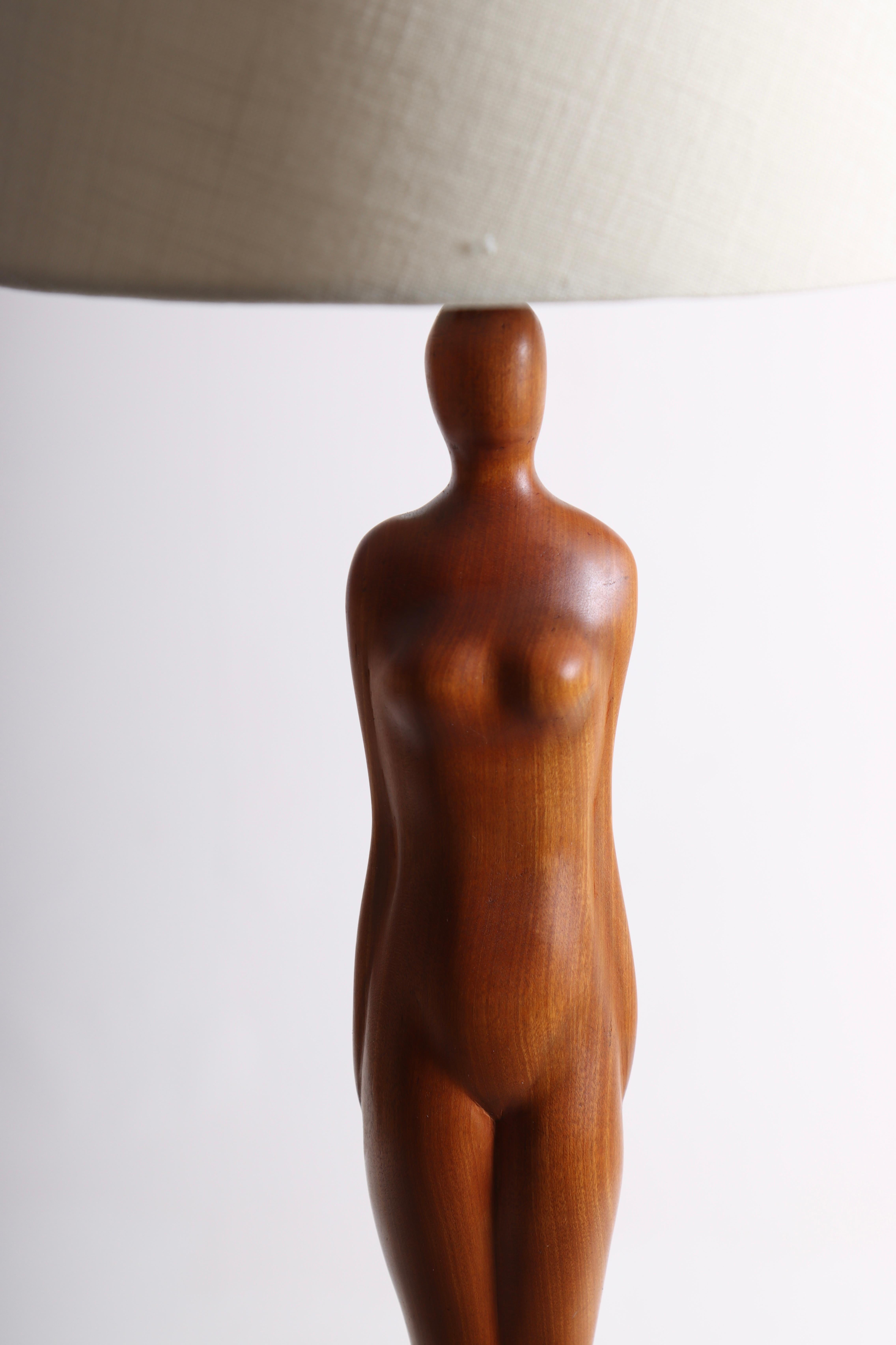 Decorative table lamp in teak, designed and made in Denmark. Great original condition. Comes with a new lampshade.
