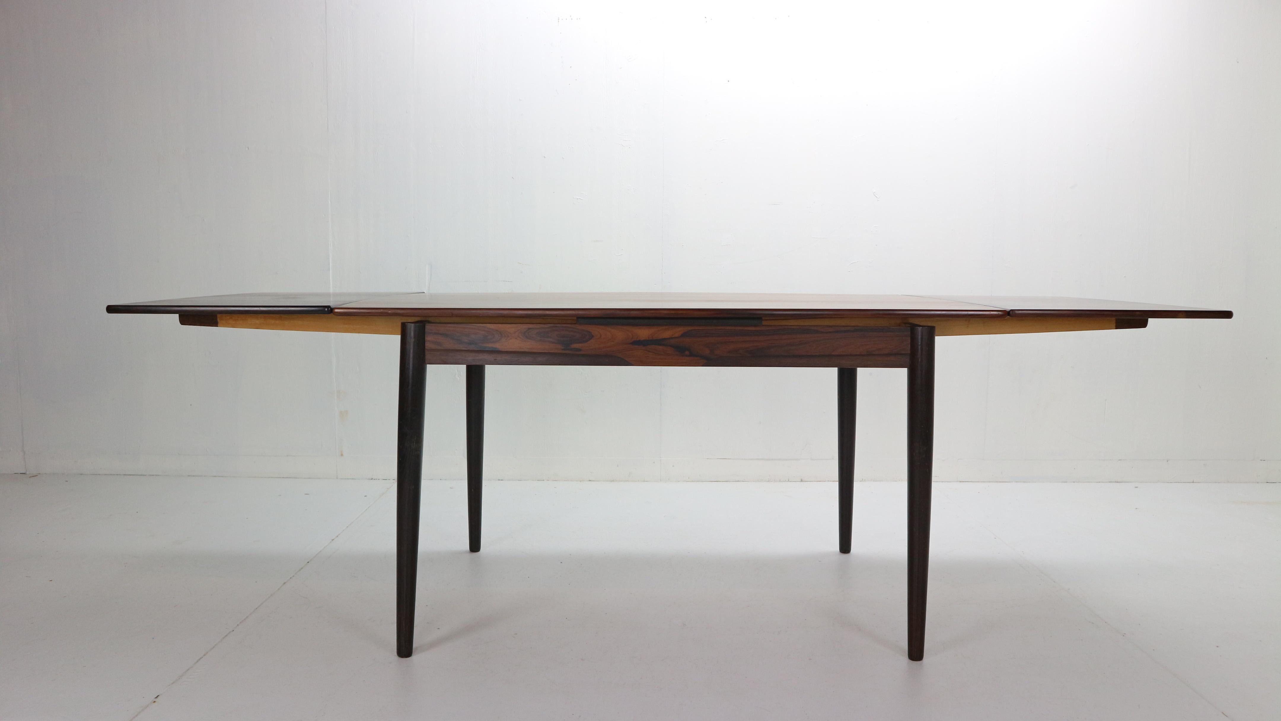 Midcentury period design extendable dining table made from rosewood. Has beautiful wood pattern and elegant legs.
Made in Denmark, 1960s.
Dimensions: 136cm, extendable 230cm.

  