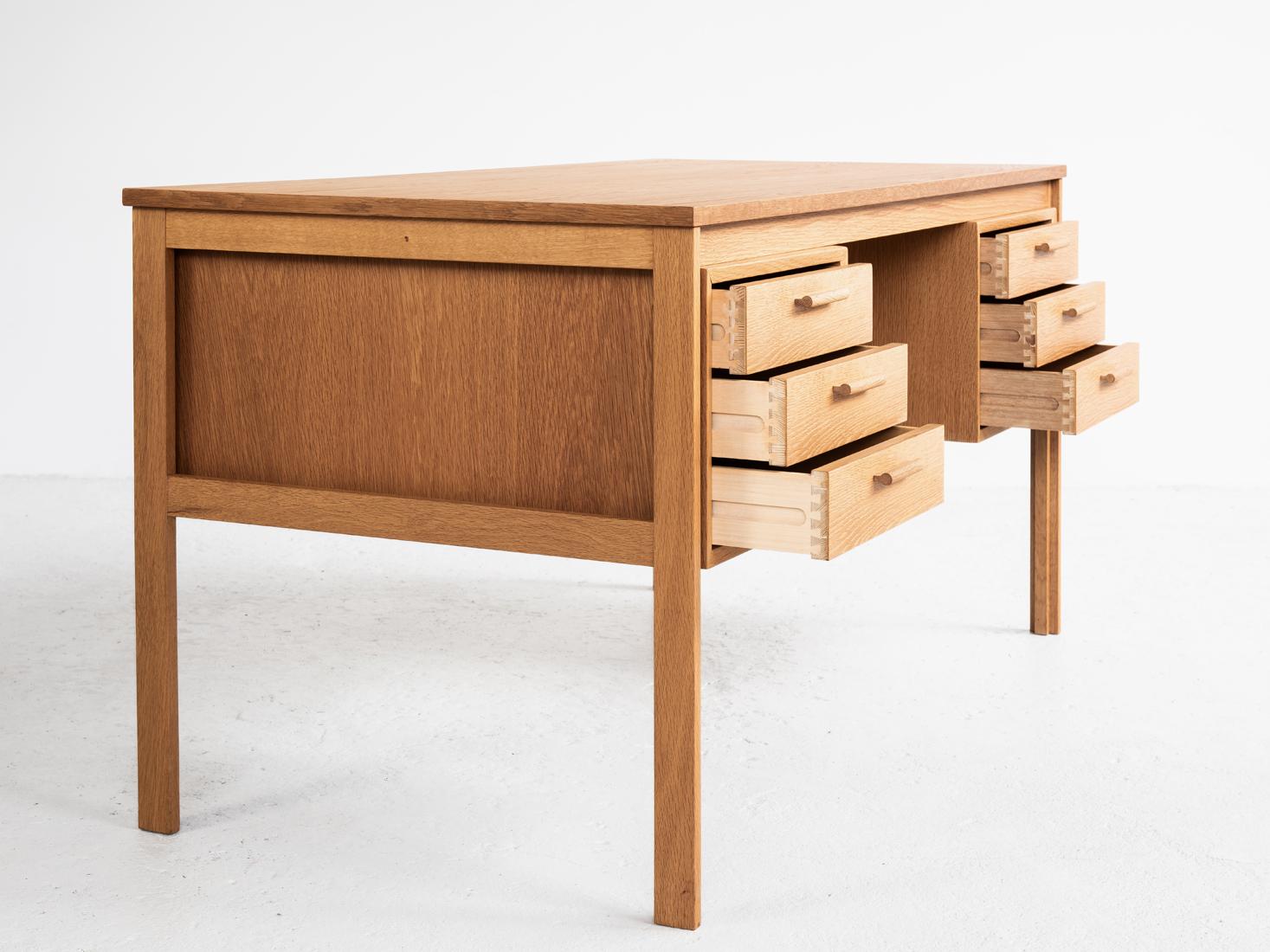 Midcentury desk in oak made in Denmark in the 1960s. Functional beautiful desk. It has a straight forward design and shows high quality manufacturing. The desk is in oak and in very good condition.
  