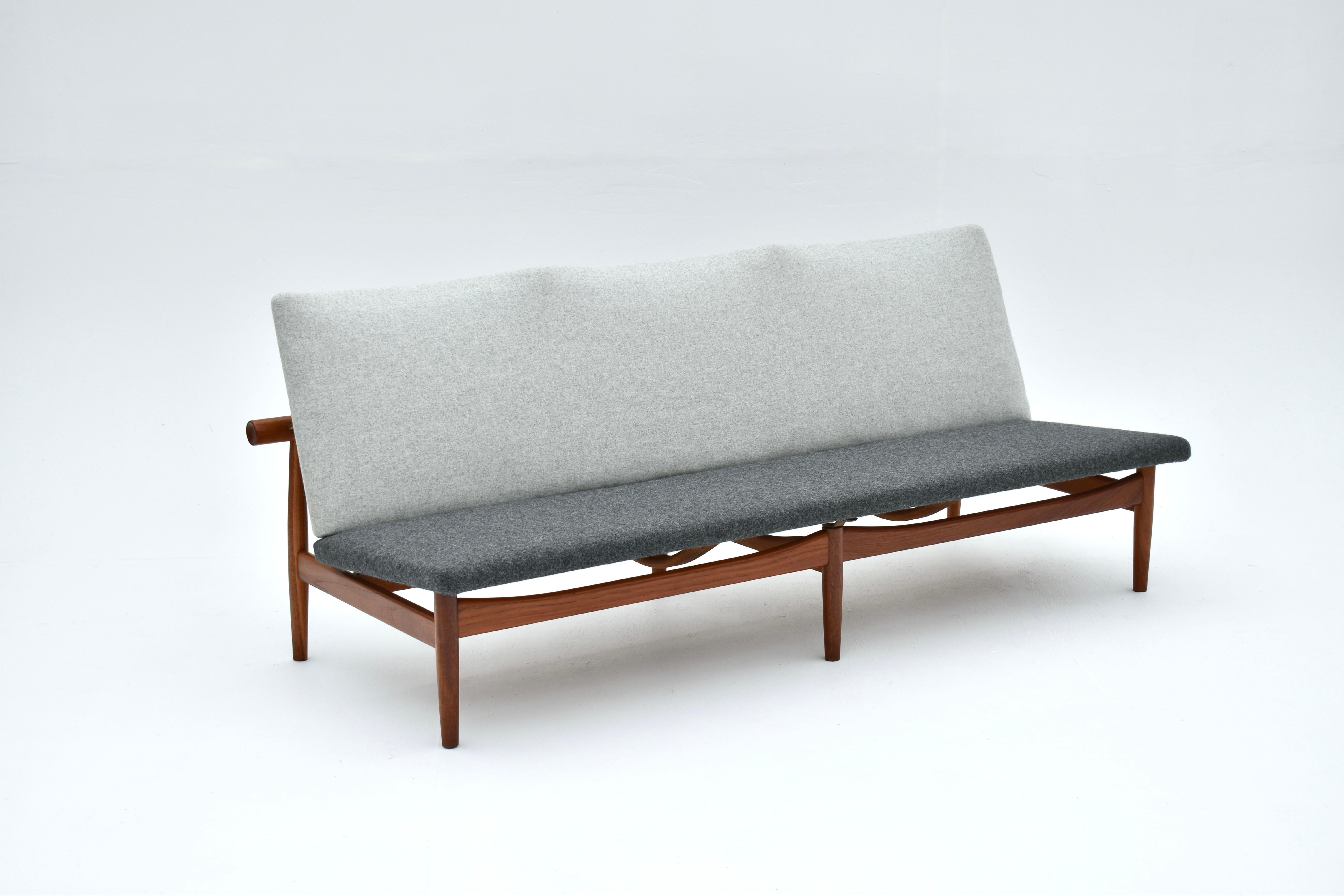 Original solid teak Japan sofa designed by Finn Juhl in 1957 for France & Son, Denmark.

An incredibly hard to find item which is a superb showcase for Juhl's unique approach to design. The Miyajima Water Gate off the coast of Hiroshima was the