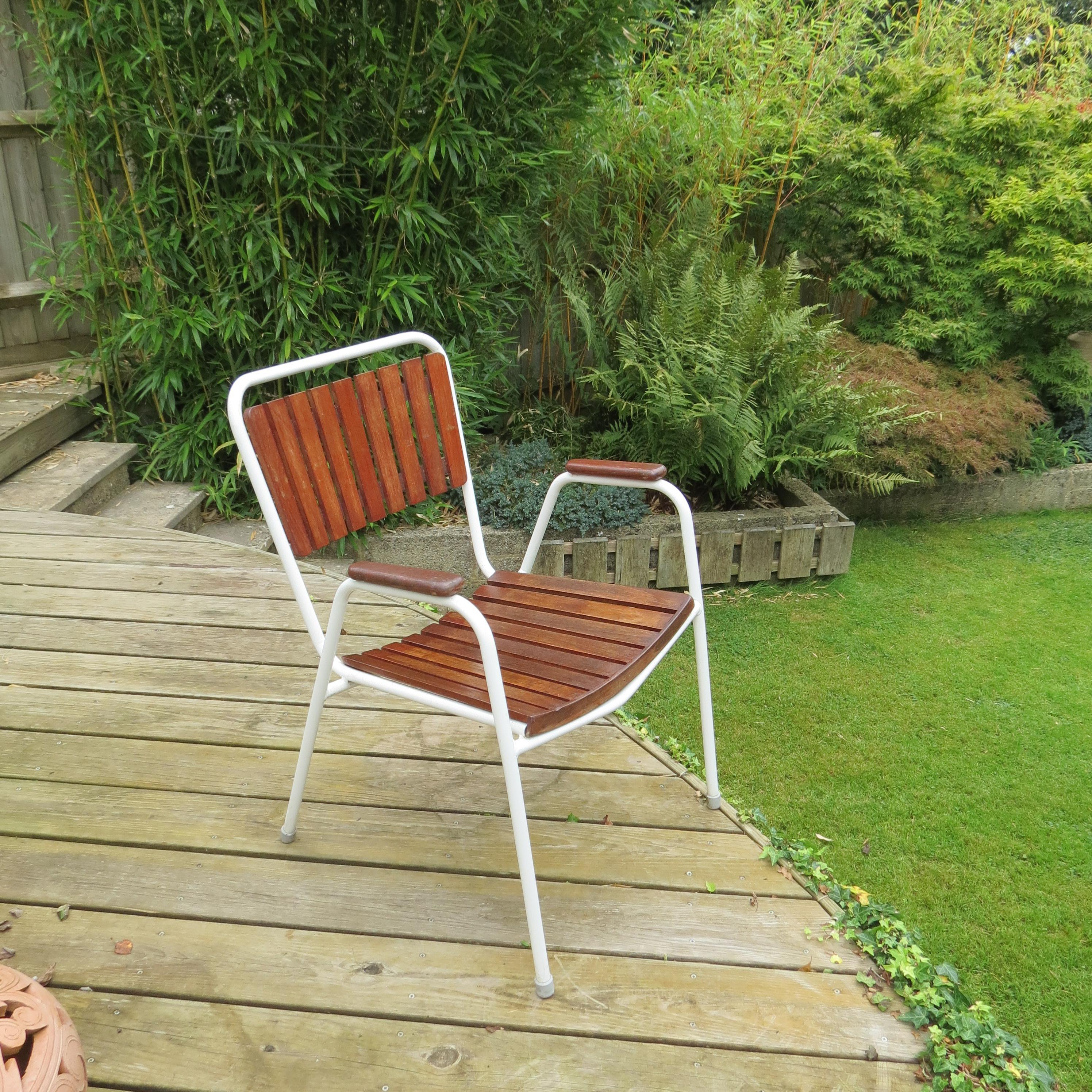Wonderful garden chair. Designed and produced by Daneline, Denmark. 

Plastic coated steel tube frames with solid Teak slatted seat and backs. 

Dating from the 1960s, in good condition, with minimal signs of wear, it retains the original white