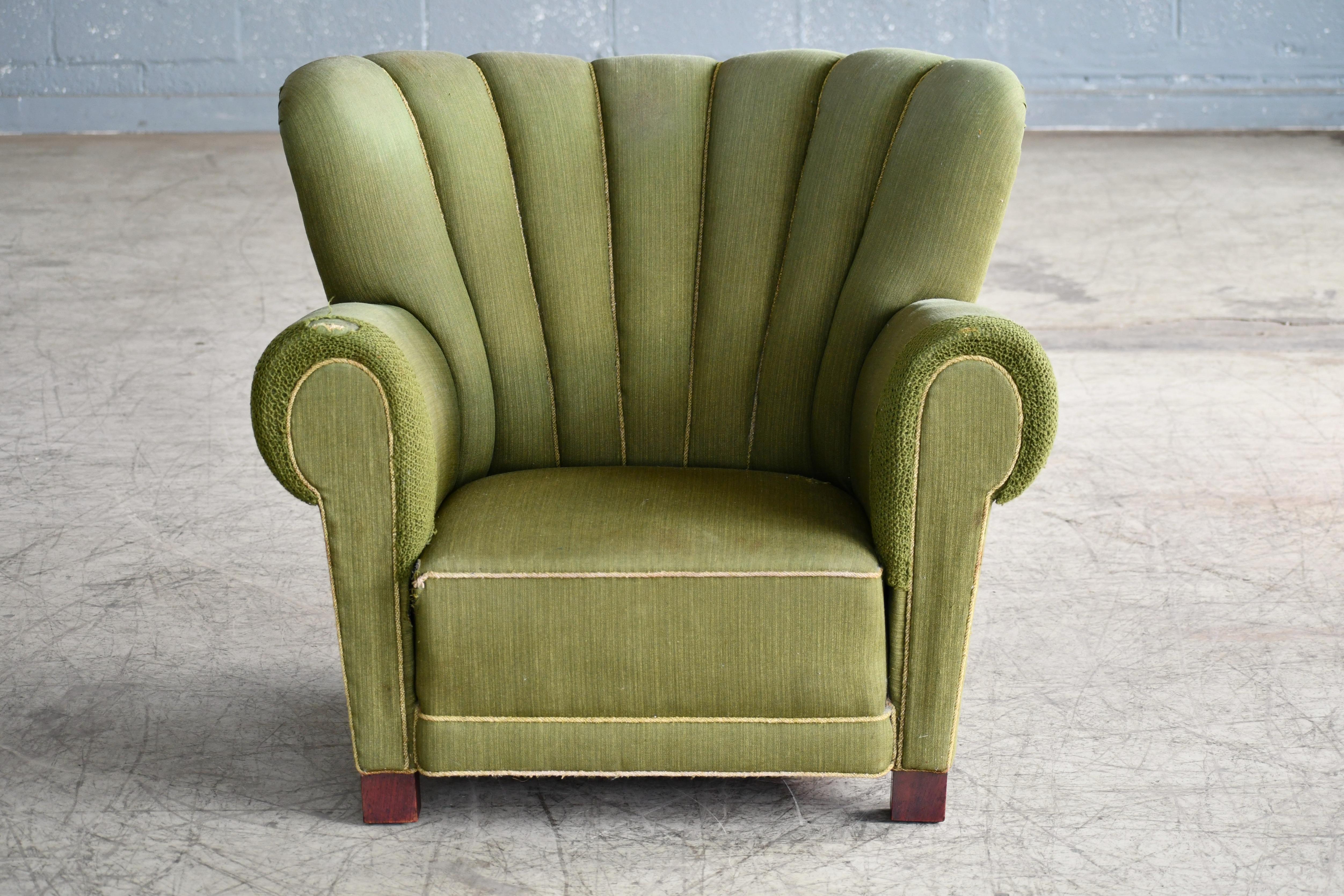 Sublime large scale club chair very similar to Fritz Hansen's famous model 1518 and likely made in the early 1940s. Superbly comfortable with dramatic low and wide proportions and a charming and very strong presence to anchor any room. We are able