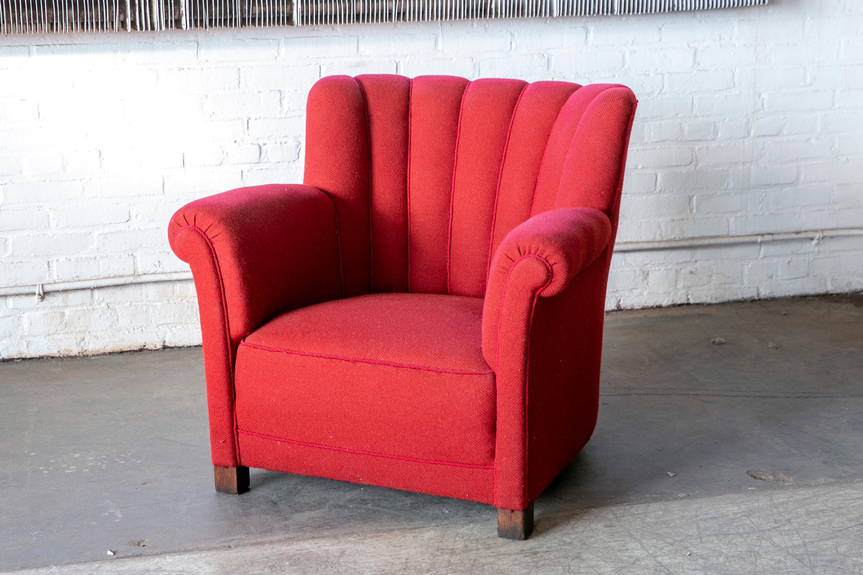 Sublime large scale club chair very similar to Fritz Hansen's model 1518 and likely made in the early 1940s. Superbly comfortable with dramatic low and wide proportions and a charming and very strong presence to anchor any room. While the wool