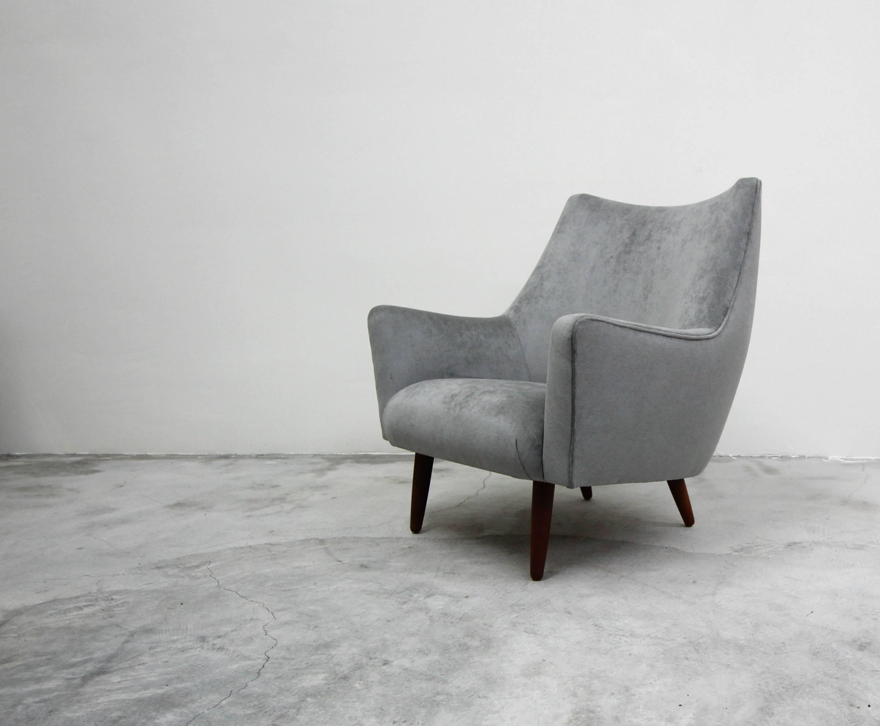 A beautiful midcentury Danish lounge chair. Large enough and stylish enough to stand alone, this gorgeous chair is the perfect one off chair for any room. Designed with Classic Danish craftsmanship, there's not a line that disappoints. Check out her