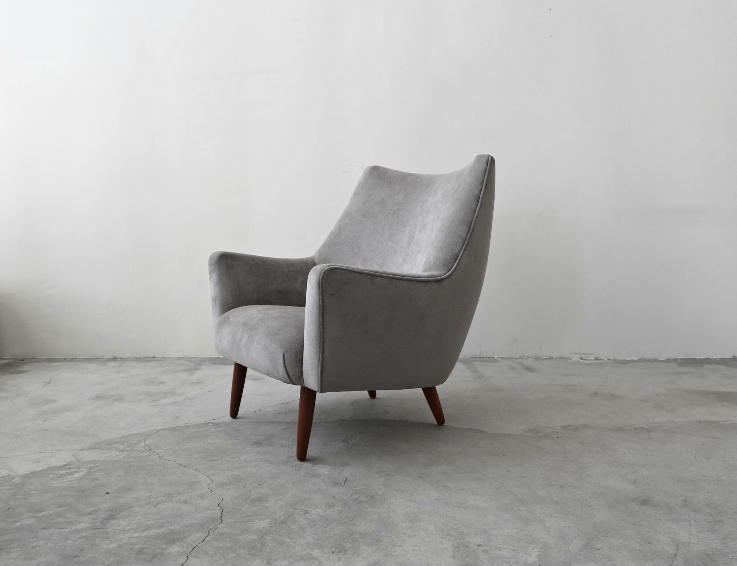 A beautiful midcentury Danish lounge chair. Large enough and stylish enough to stand alone, this gorgeous chair is the perfect one off chair for any room. Designed with Classic Danish craftsmanship, there's not a line that disappoints. Check out her