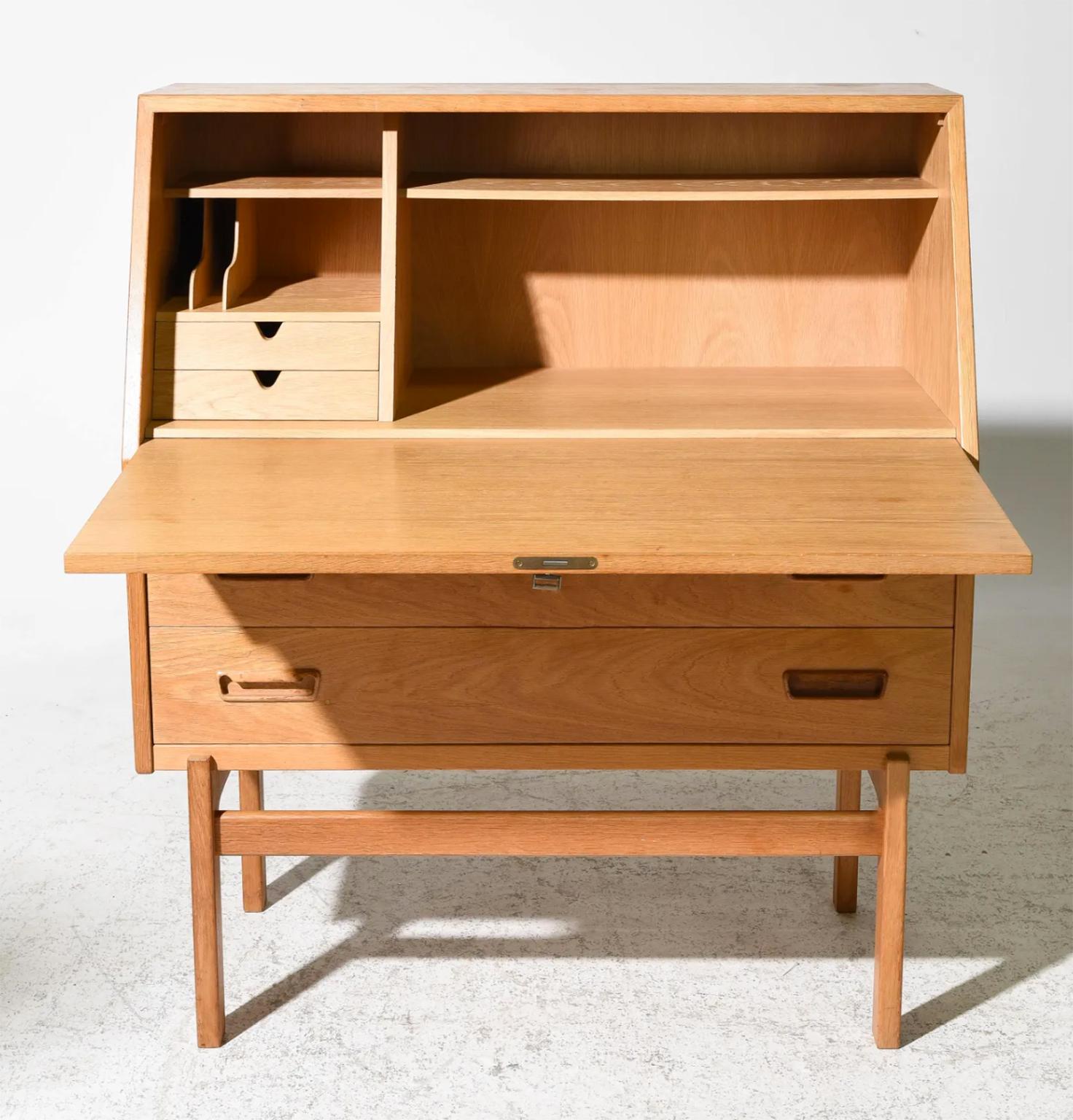midcentury Arne Wahl Iversen for Vinde Mobelfabrik in light teak desk Model No. 68. Featuring a flip down front with 2 drawers and organizer slots. Beautiful all wood construction including brass hinges with wonderful patina. teak grain is stunning.
