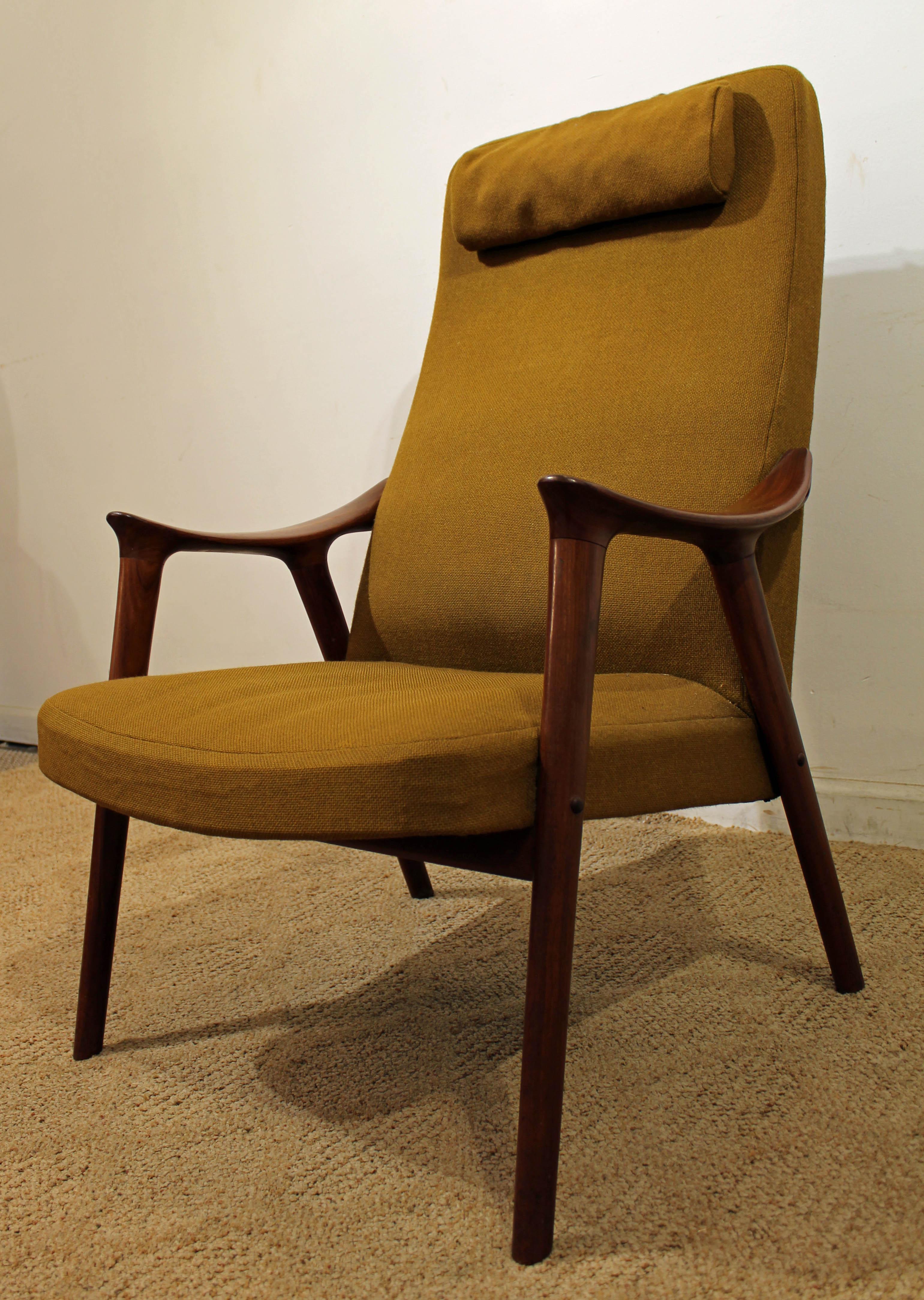 What a find. Offered is a Mid-Century Modern arm/lounge chair. It is made of teak with a removable, weighted headrest, similar to the style of Folke Ohlsson. It will need to be reupholstered. It is not signed. See our other listings for more