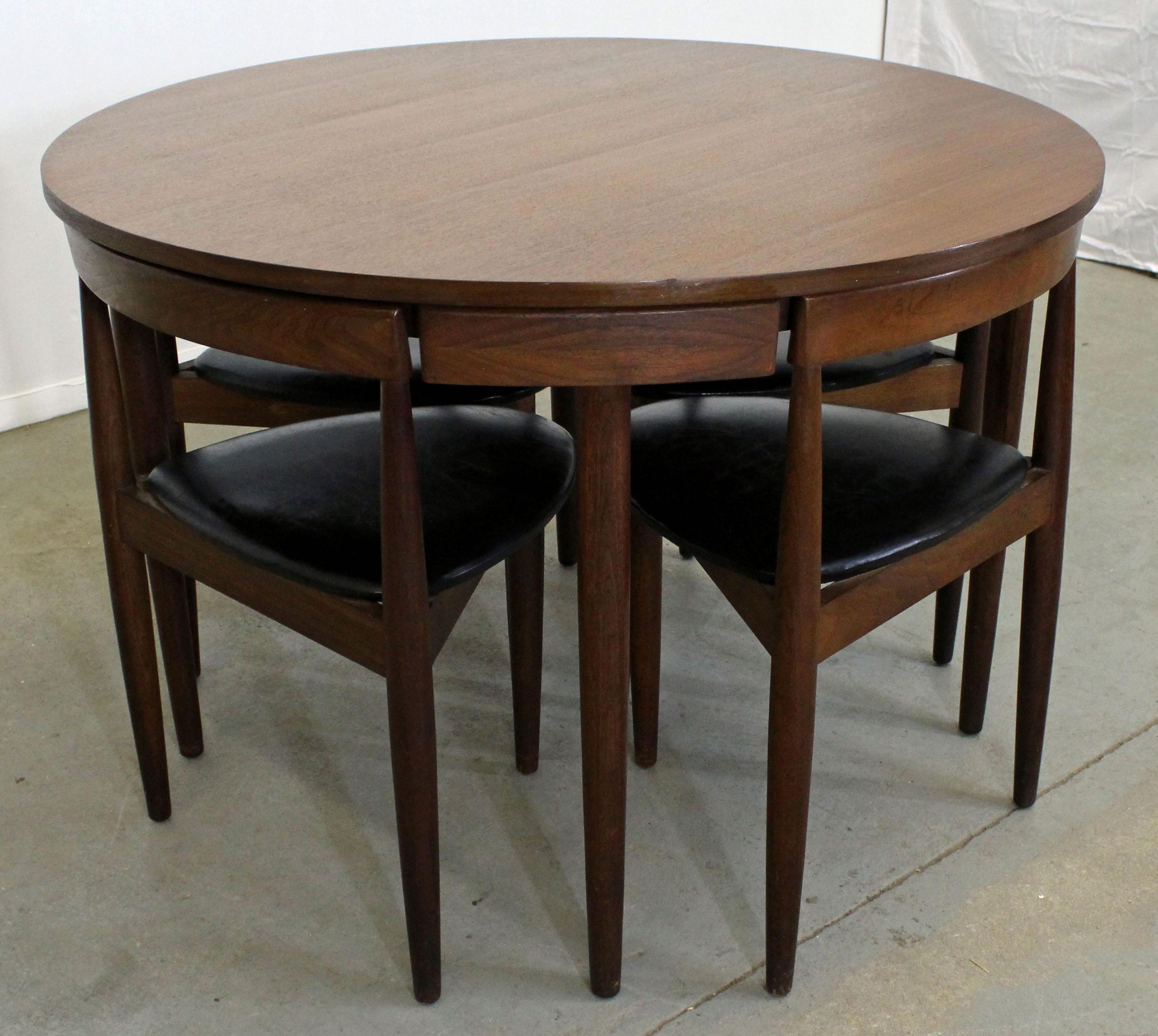Offered is a Danish Modern teak dining table and set of 4 chairs, designed by Hans Olsen for Frem Rojle. Features a teak round table (no extension boards) and set of 4 chairs with three legs. The set is in excellent condition, showing minor surface