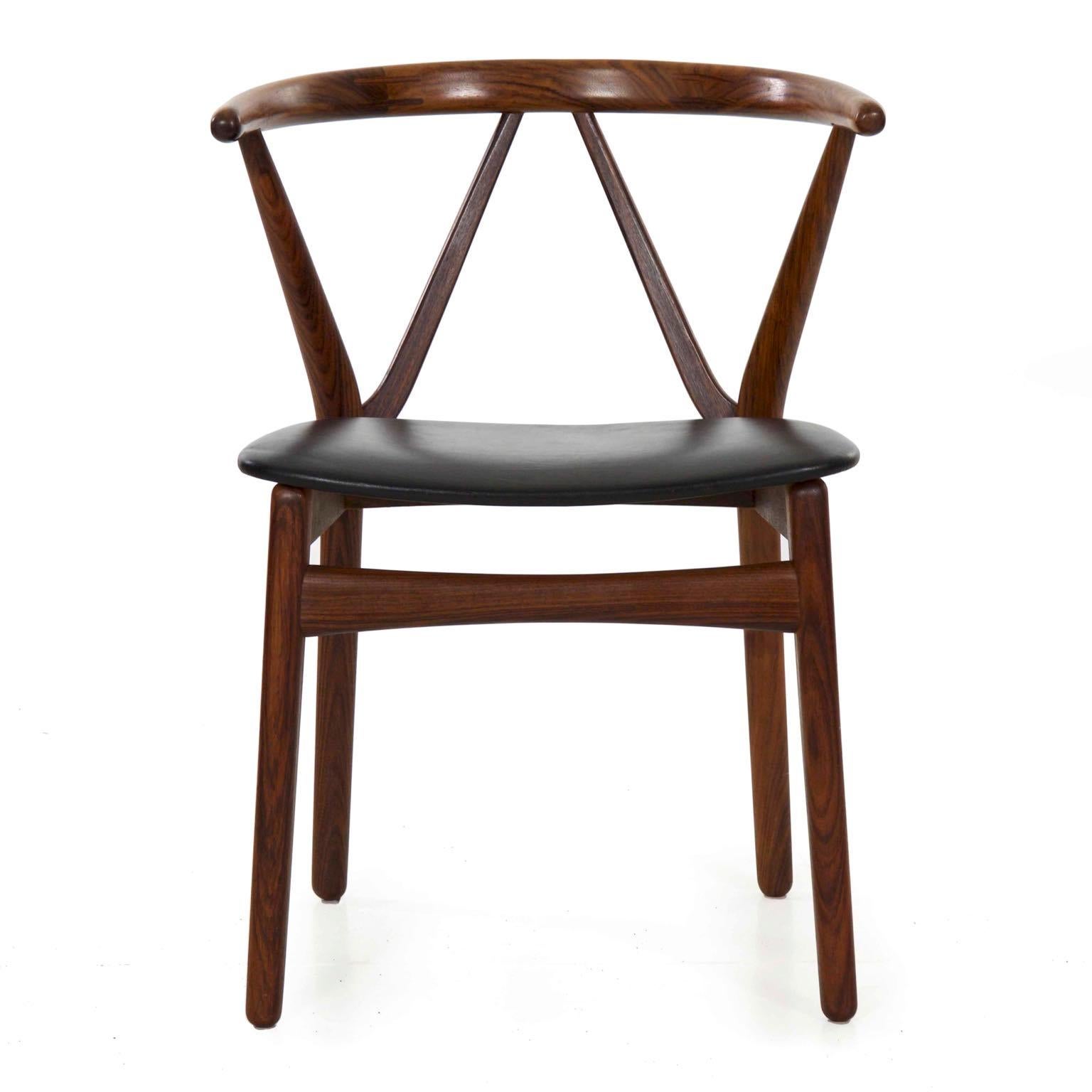 Danish rosewood hoop back armchair by Kjaernulf for Hansen
Model 255; Bruno Hansen stamp to underside, Denmark, circa 1950s.
 

This gorgeous armchair was designed by Henning Kjaernulf for retail by Bruno Hansen in Denmark during the 1950s with