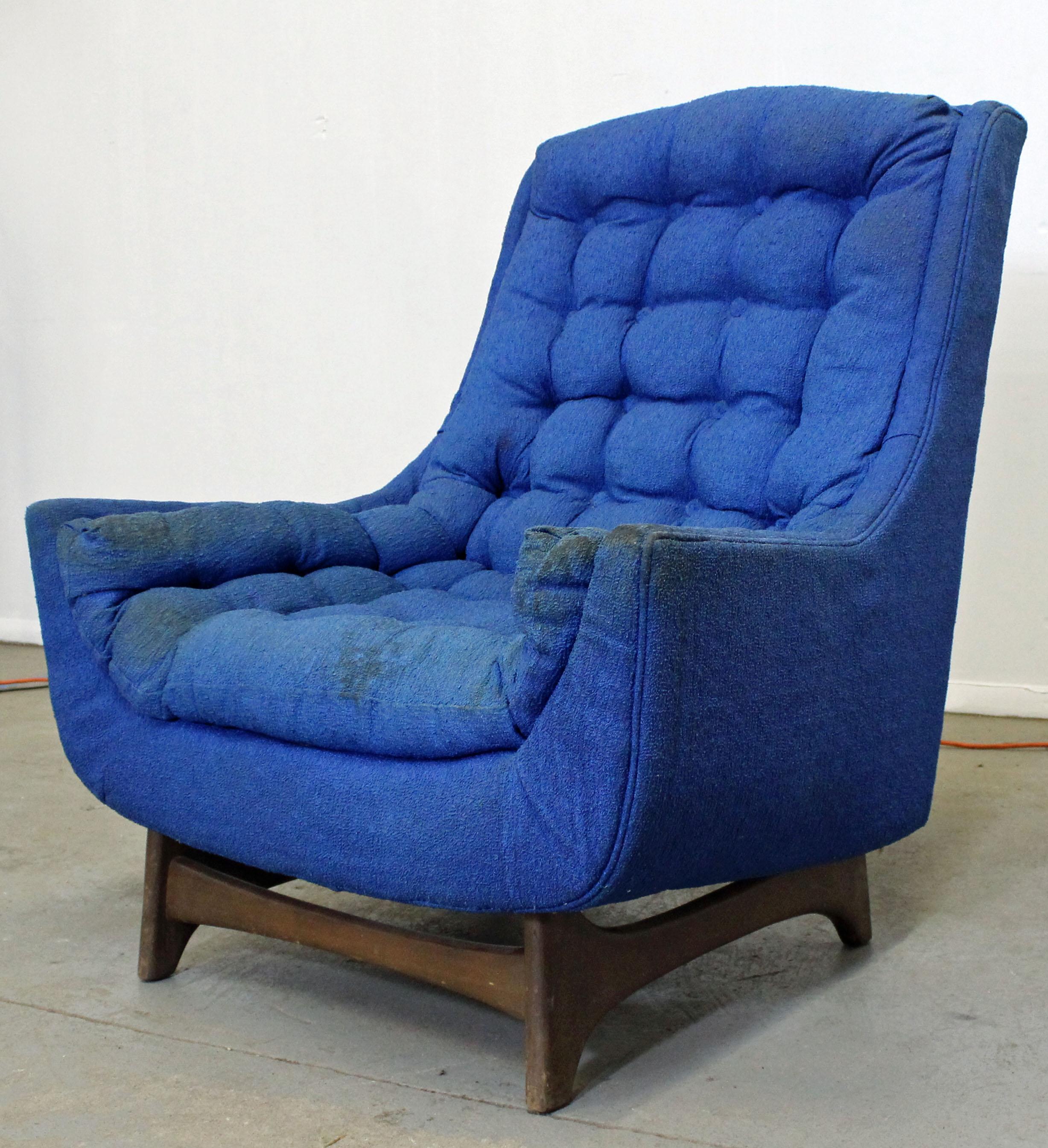 What a find. Offered is a Mid-Century Modern lounge chair with blue upholstery and a walnut base. It is structurally sound, but needs to be reupholstered). It is not signed. See our other listings for more midcentury and Danish modern