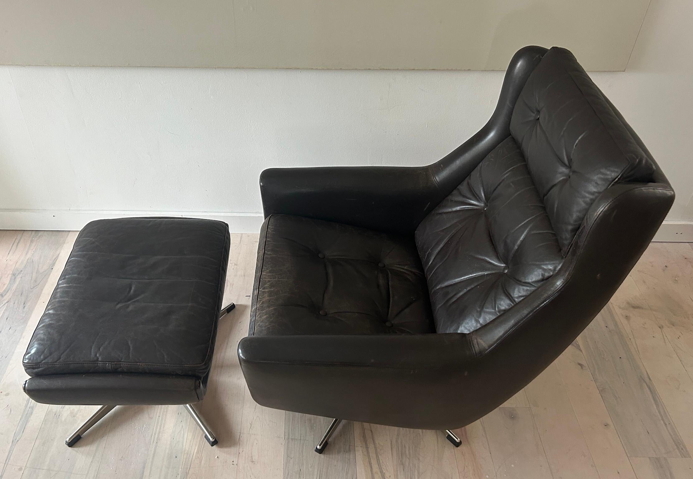 midcentury Danish Modern dark brown leather lounge chair and ottoman by Erhardsen & Anderson ERAN. Danish modern chair and ottoman. Chrome steel bases, removable leather cushions and ottoman with cushion, lounge chair is adjustable allows for