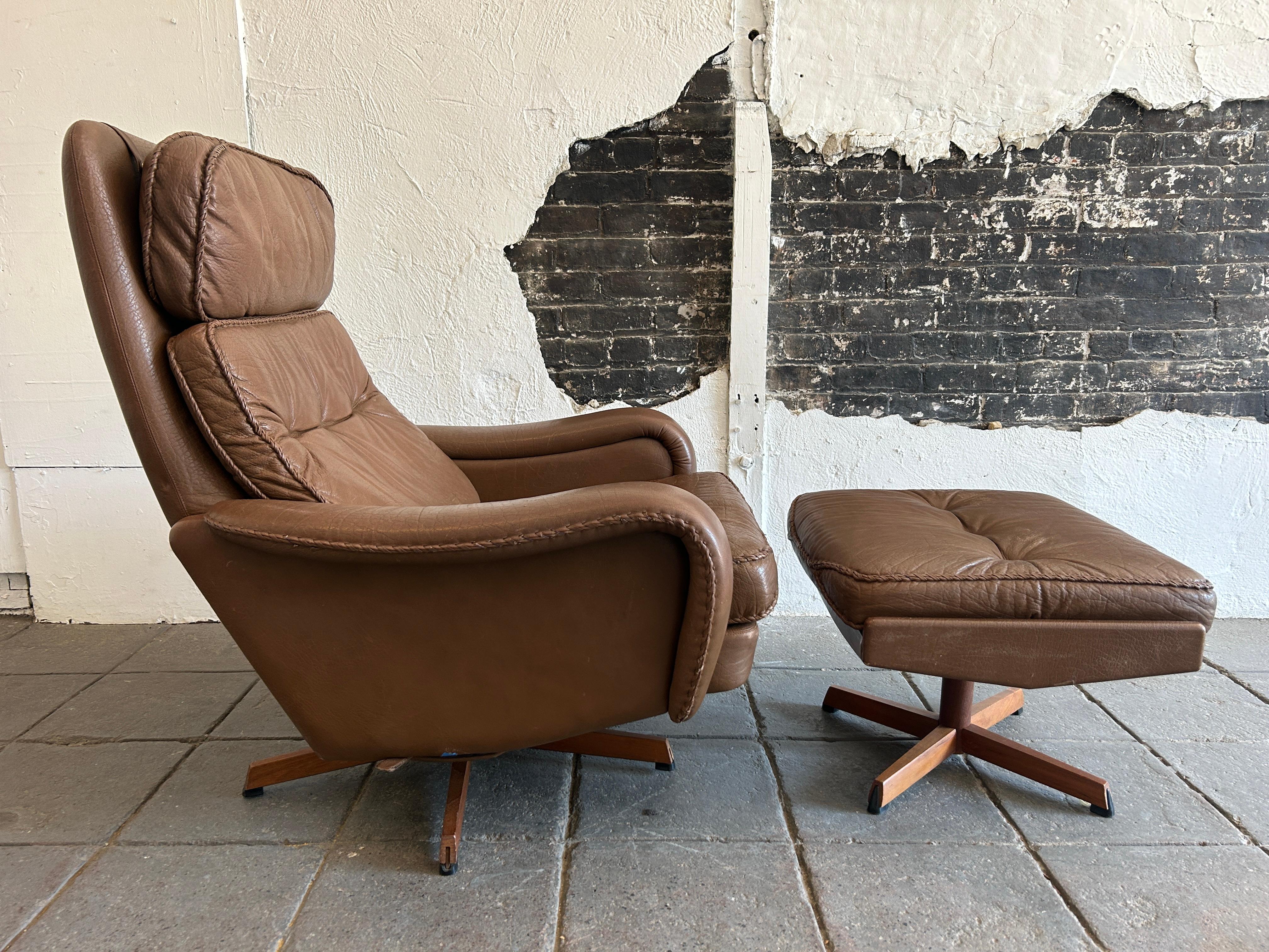 Midcentury Danish Modern brown Buffalo leather lounge chair and ottoman by Madsen & Schubell. Leather has woven leather stitching. Danish modern chair and ottoman. Teak wood bases, removable leather cushions and ottoman with cushion, lounge chair is