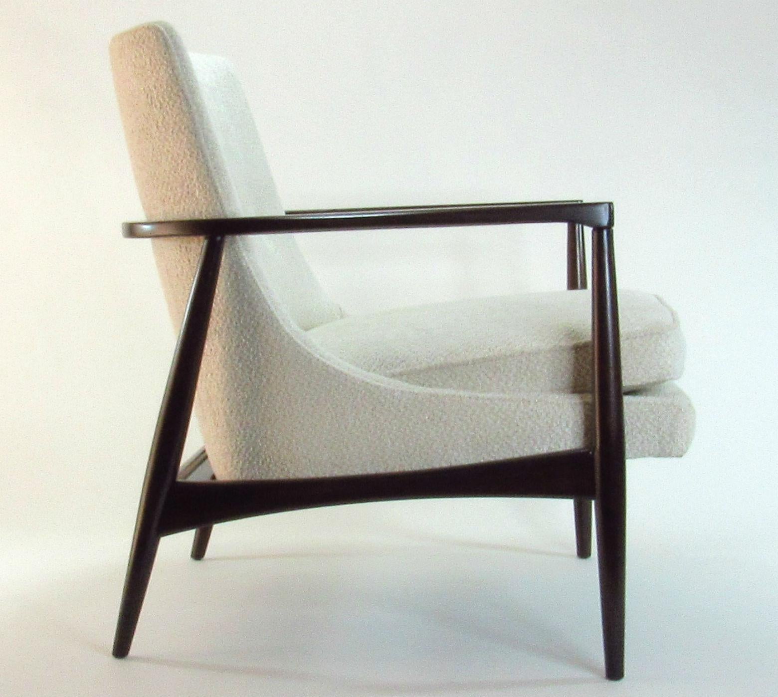 Midcentury Danish Modern lounge chair with beautifully curved refinished wrap-around frame and new imported woven chenille upholstery in neutral oatmeal. Comfortable, soft and sculptural. In excellent restored condition.