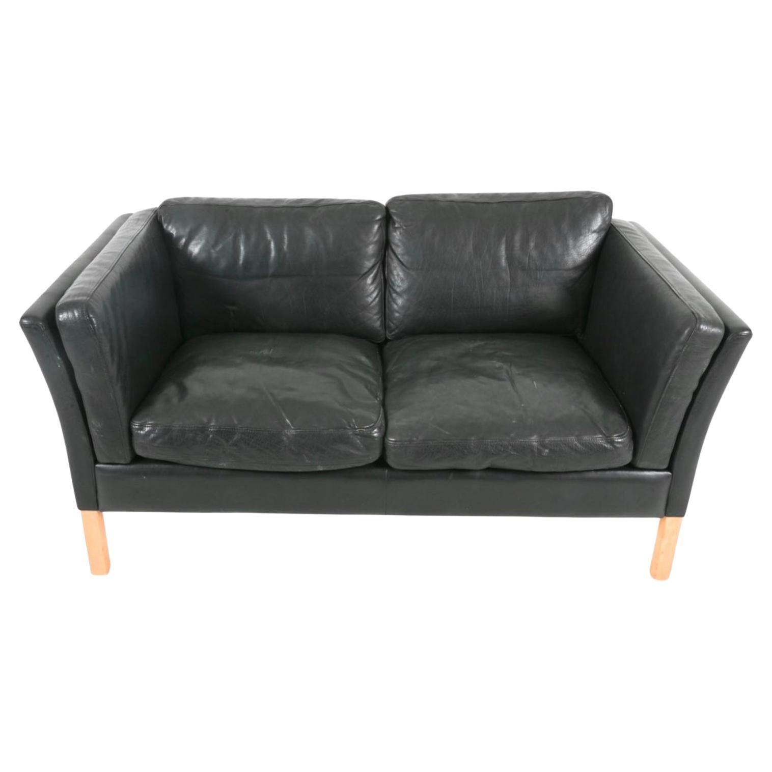 Mid Century Scandinavian modern Curved arm Low Mid century Danish modern Black leather 2 seat sofa with Birch wood legs. Style of Børge Mogensen. Beautiful thick Black leather is soft and shows signs of use but broken in nicely. Down filled