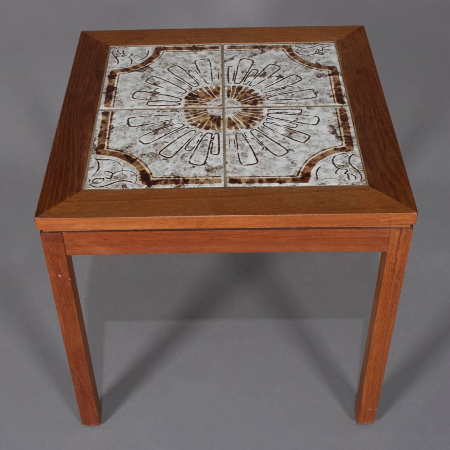 Midcentury Danish modern Nils Thorsson school tile top side table features walnut frame with California tile top in stylized sunburst pattern, circa 1960.

Measures: 20