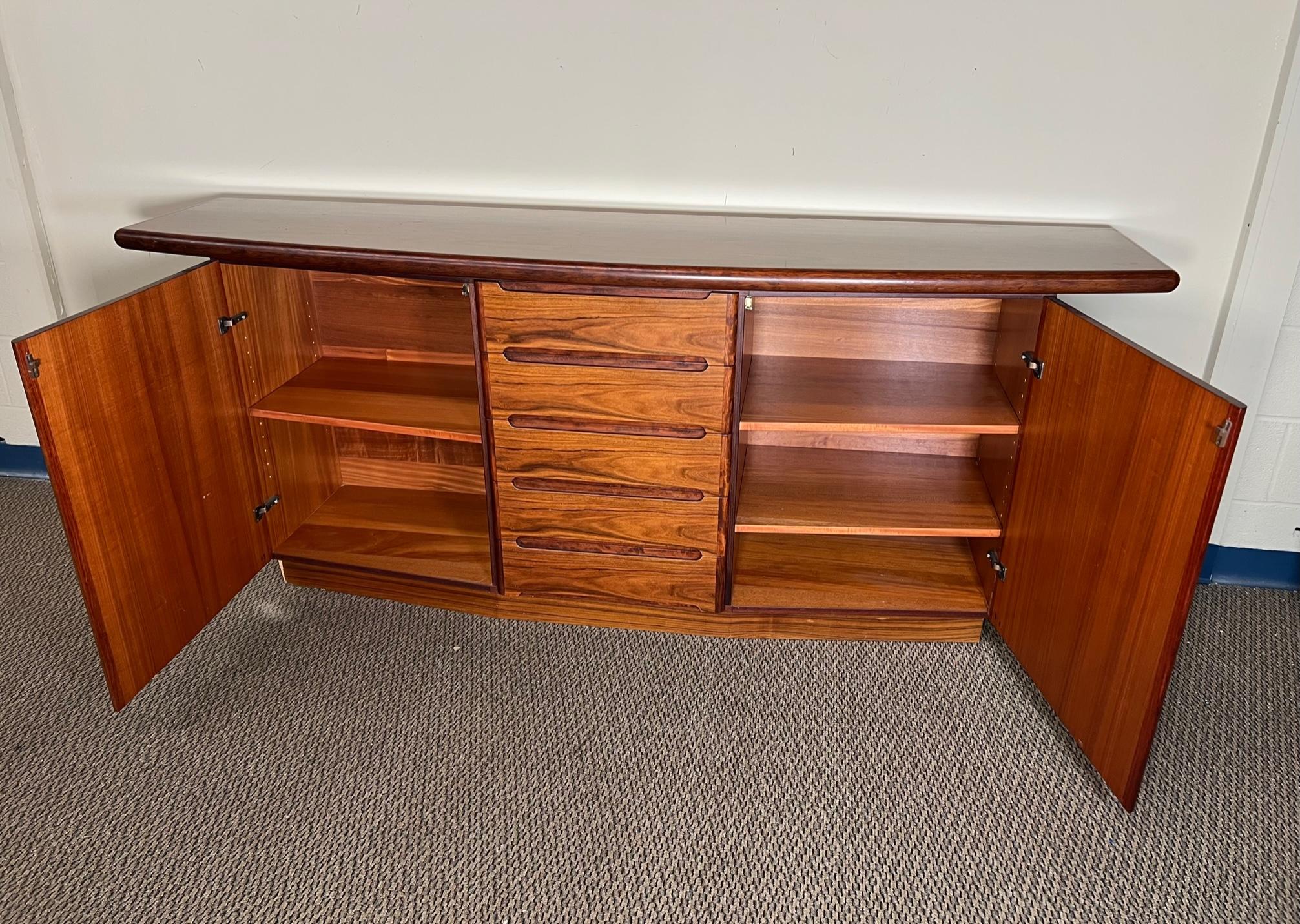 Outstanding rosewood credenza or buffet by Skovby. Lots of storage. Adjustable shelves. Fantastic condition. Clean drawers all open and close well. Some minor marks from normal use. Doors do not stay closed. Latches may need adjusting.
Dimensions: