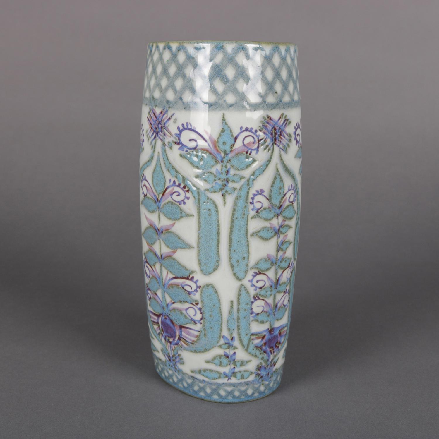 Midcentury Danish modern hand-painted Royal Copenhagen Aluminia Faience porcelain vase features all-over stylized floral and foliate design, Danish heavy porcelain painted vase, marked with beehive and artist signed Marianne Johnson on base, 20th