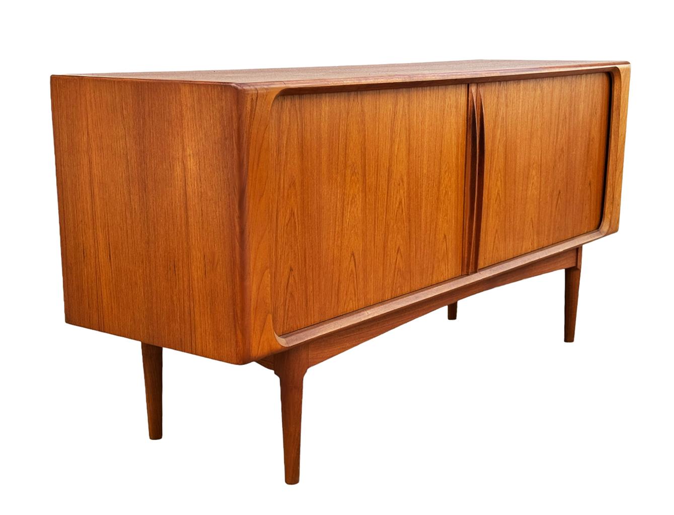 A lovely and teak credenza Model 142 produced by Bernhard Pedersen & Son in the 1960s. This cabinet is very clean and has ample storage. Doors and drawers work as they should. Ready for immediate use.