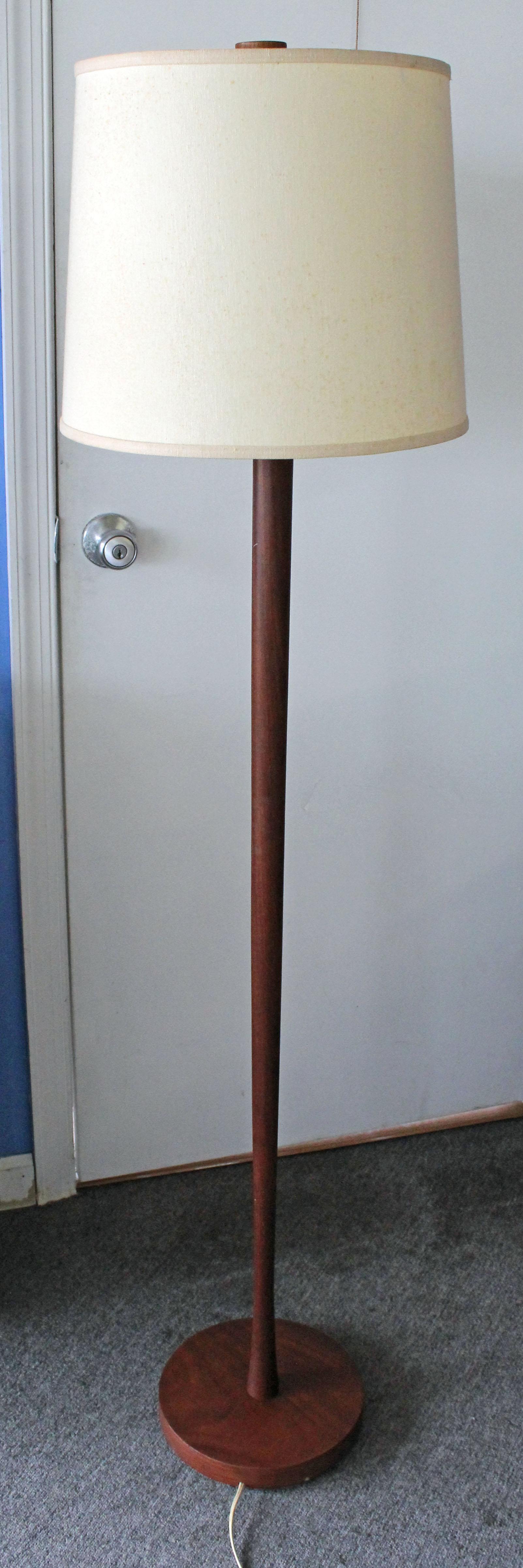 Offered is a vintage, Mid-Century Modern teak floor lamp. It is in great, working condition showing minor age wear (see photos: shade is not included, lighting tested, rust on harp, minor surface wear). It is unmarked. Really cool lighting for any
