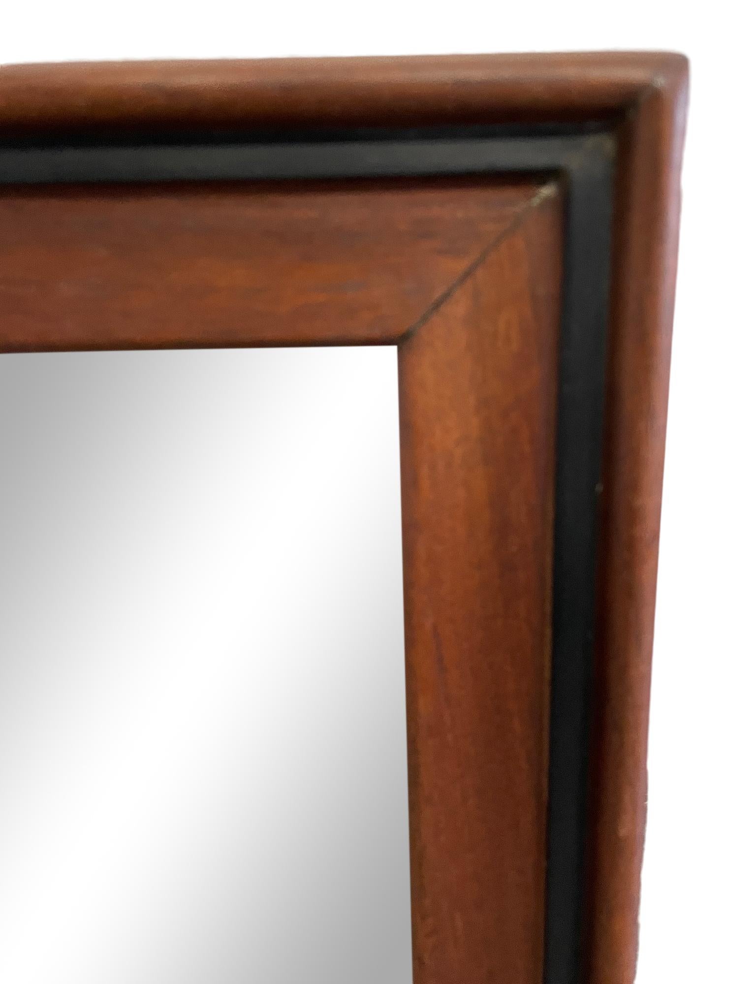 Wonderful Scandinavian Danish modern teak wood mirror. not Wired to hang. Very solid mirror with solid teak wood frame with a black lacquer detail. 22