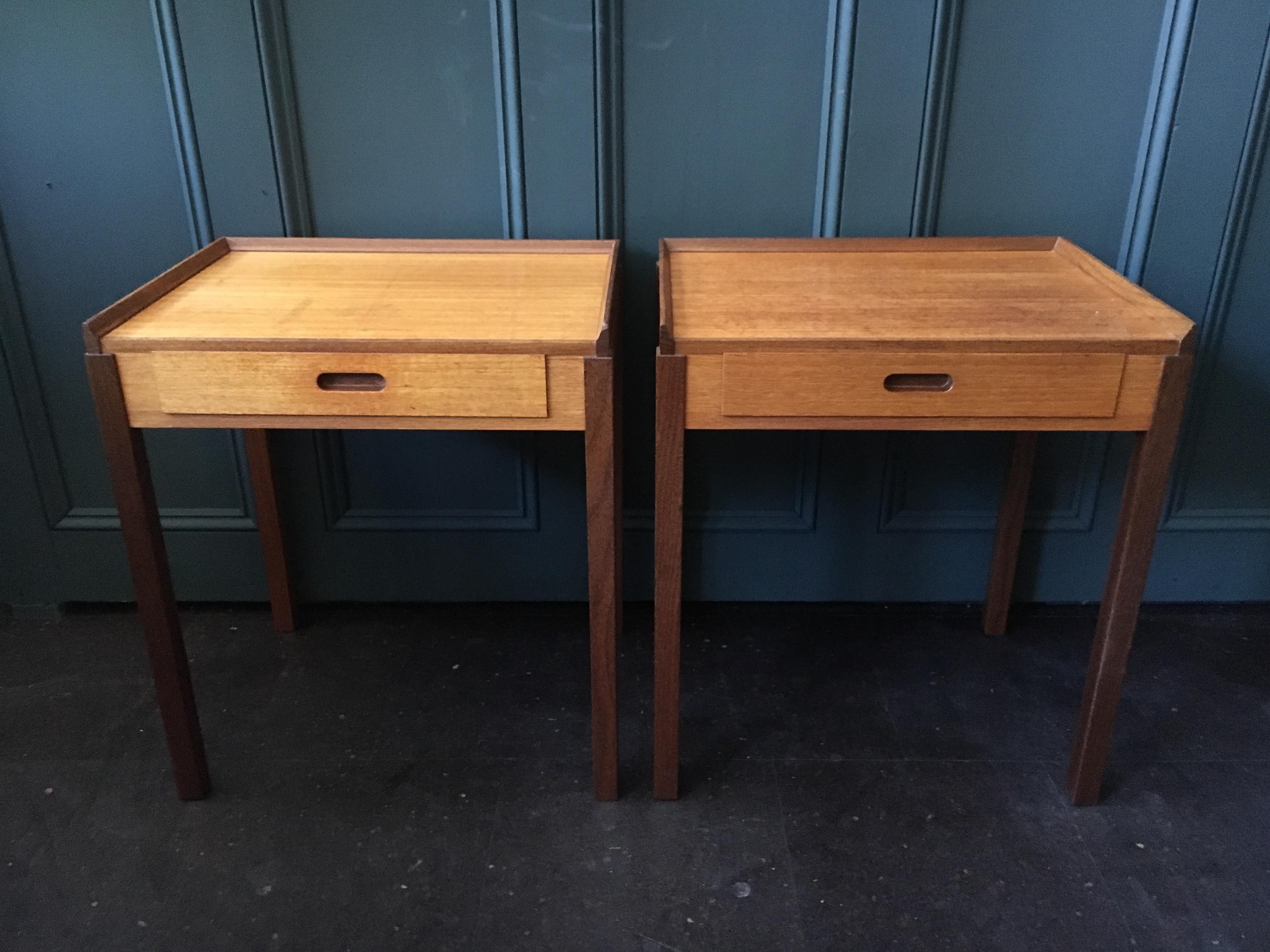 Superb pair of modernist bedside tables. These Danish midcentury nightstands are constructed from teak and were produced in the early 1960s. In great condition. Pure Scandinavian design.