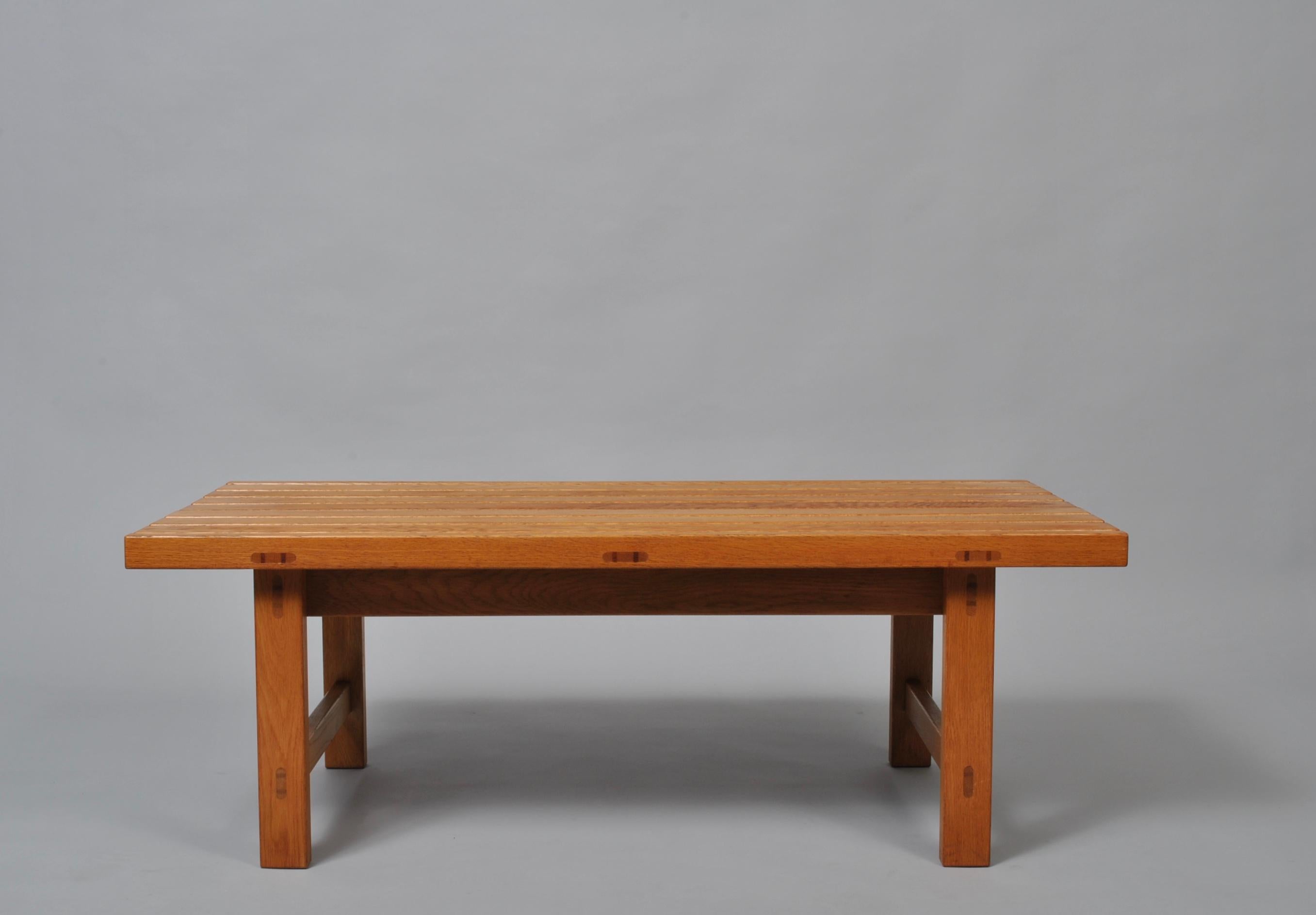 A lovely Mid-Century Modern bench or table. Expertly created Danish craftsman oak bench - or table - in the manner of Borge Mogensen. Beautiful exposed joints to the European oak construction. Produced circa 1960, Denmark. Can be very easily