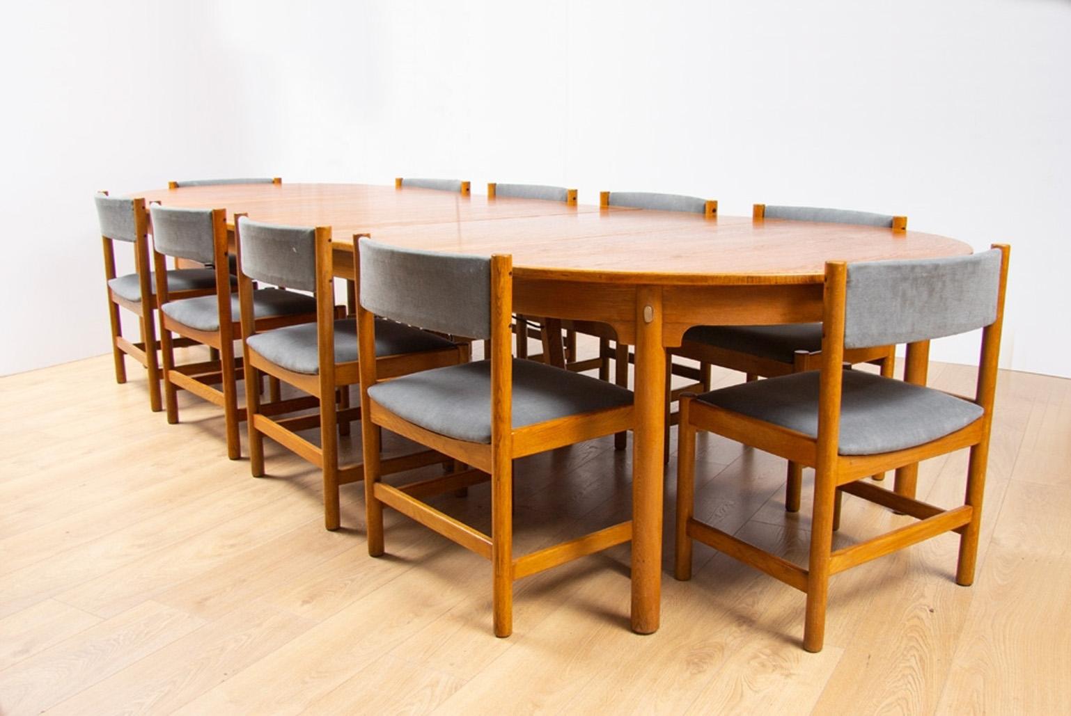 Midcentury oak Børge Mogensen dining or boardroom table and ten chairs with three leaves.