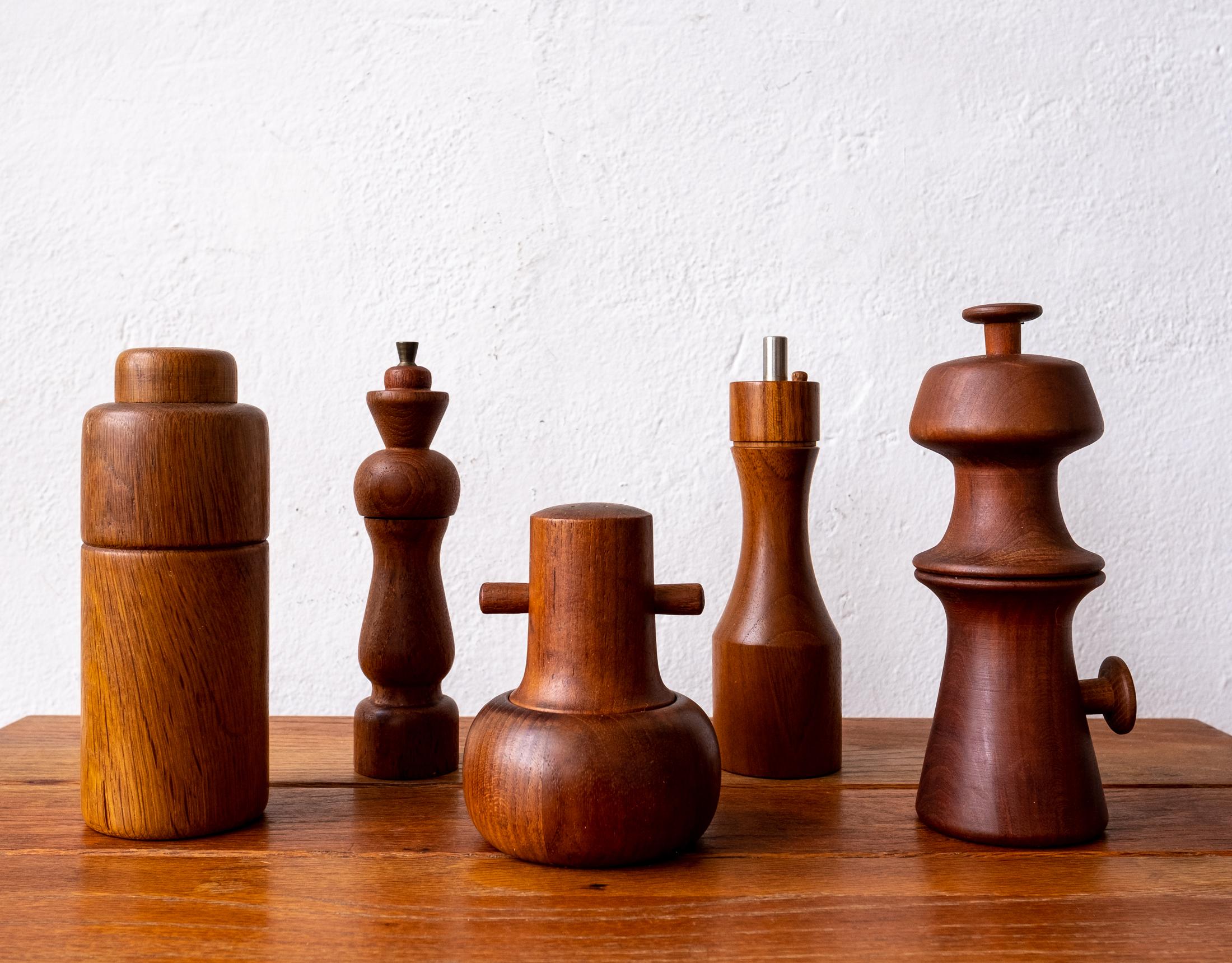 Collection of five teak pepper mills by Richard Nissen and other Danish makers. Four mills were produced in Denmark and one Lauffer Mill was produced in USA,. All circa 1960s. 

 
