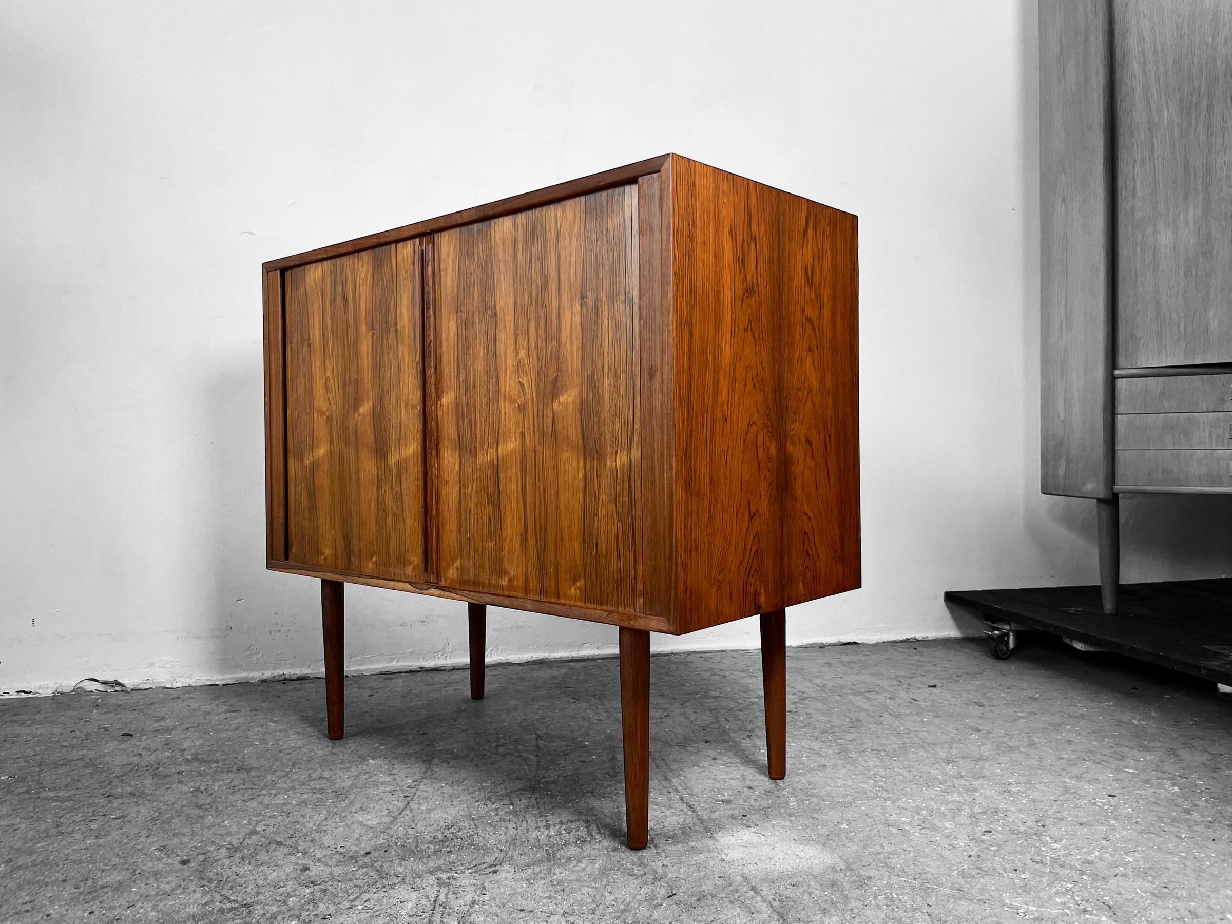 A CABINET WITH TAMBOUR DOORS - KAI KRISTIANSEN 

 Cabinet with tambour doors. Design by Kai Kristiansen and made in Denmark. 

H85 cm  DEPTH40 cm  HEIGHT77 cm 