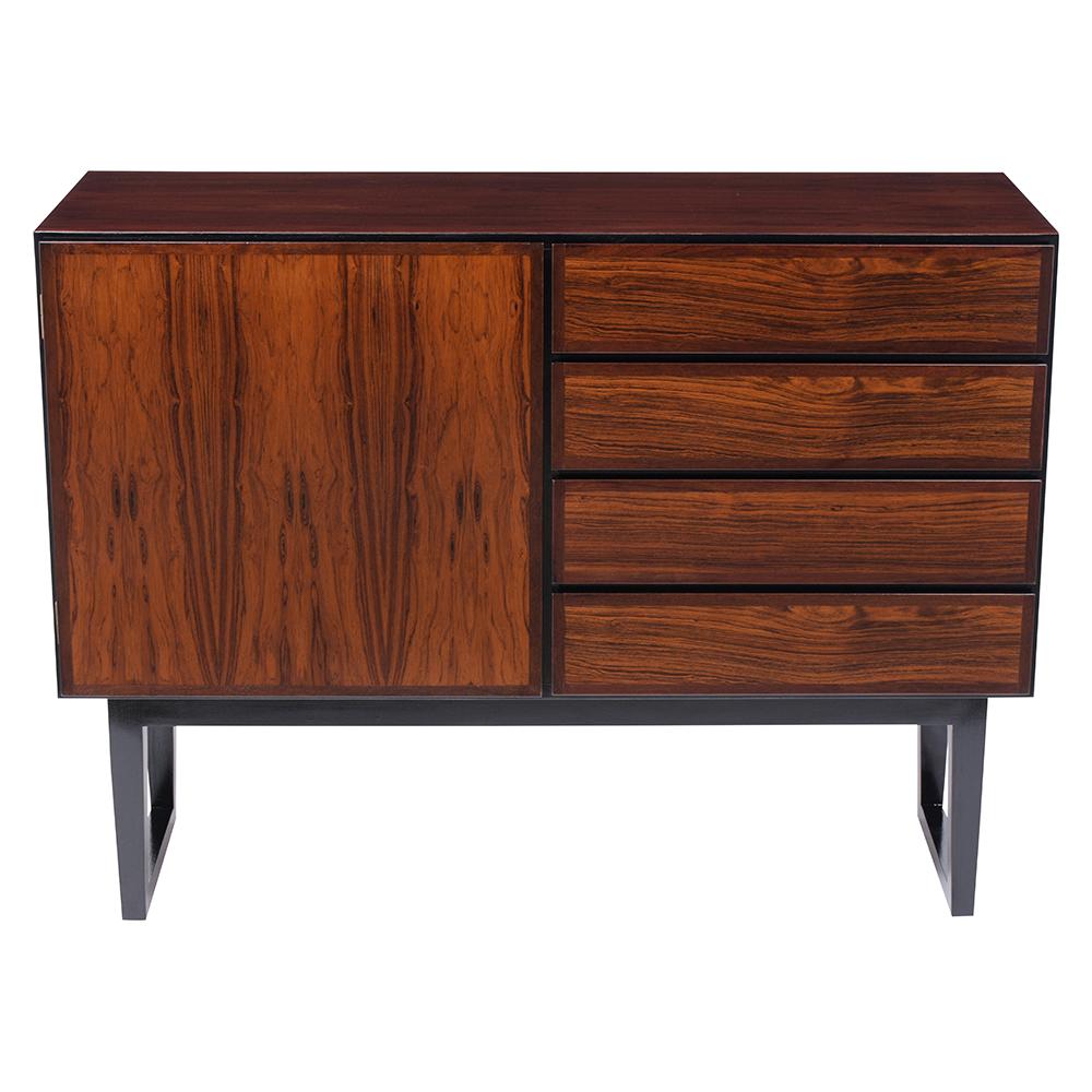 A Danish Modern Credenza made out of rosewood with new mahogany & ebonized stained color combination, lacquer finish, and is fully restored. This fabulous piece features a single door with adjustable wood shelves inside, four drawers that open/close