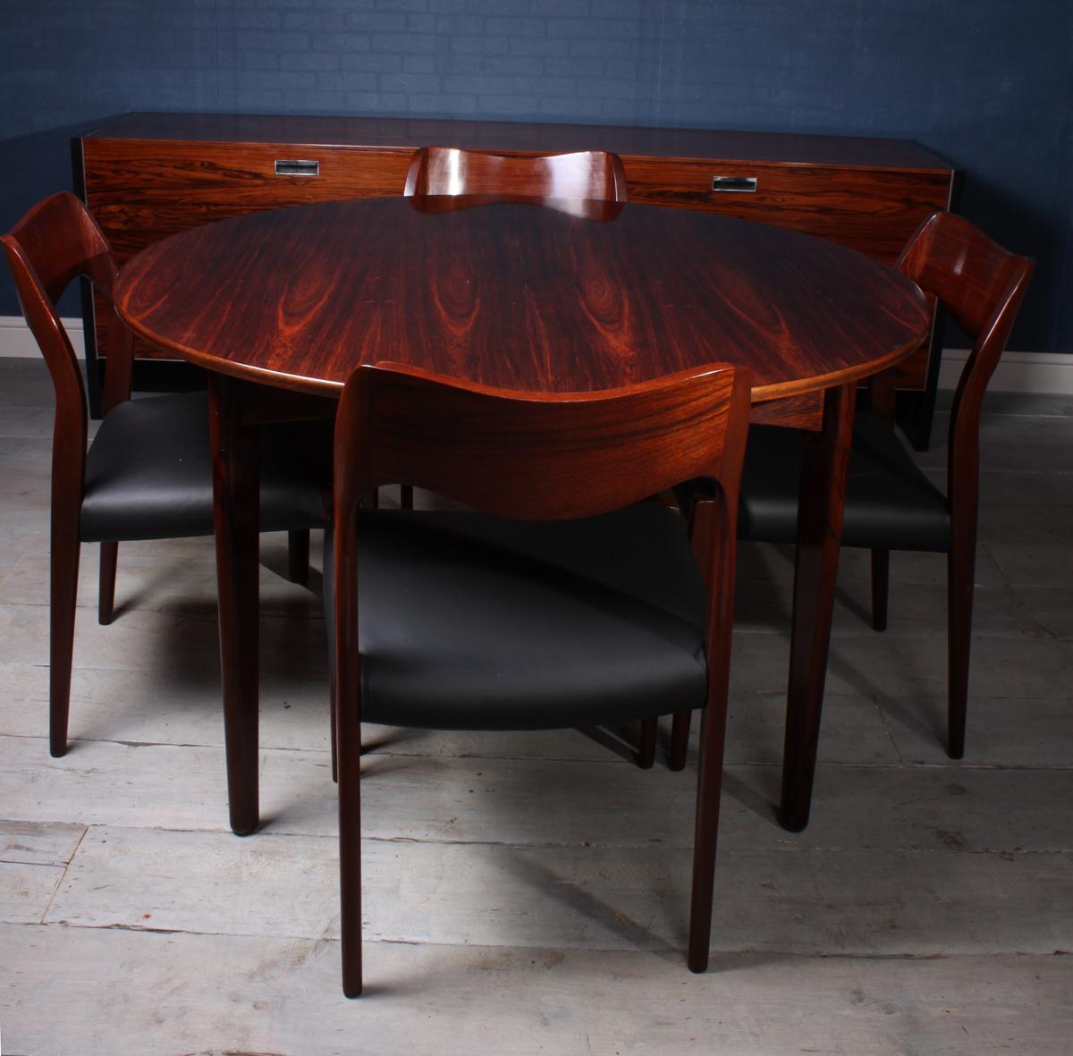 Midcentury Danish rosewood dining table
A Danish produced two leaf dining table this has four removable legs, pull open top on solid beech runners and two leaves, it has been fully polished and is in excellent condition throughout

The table is
