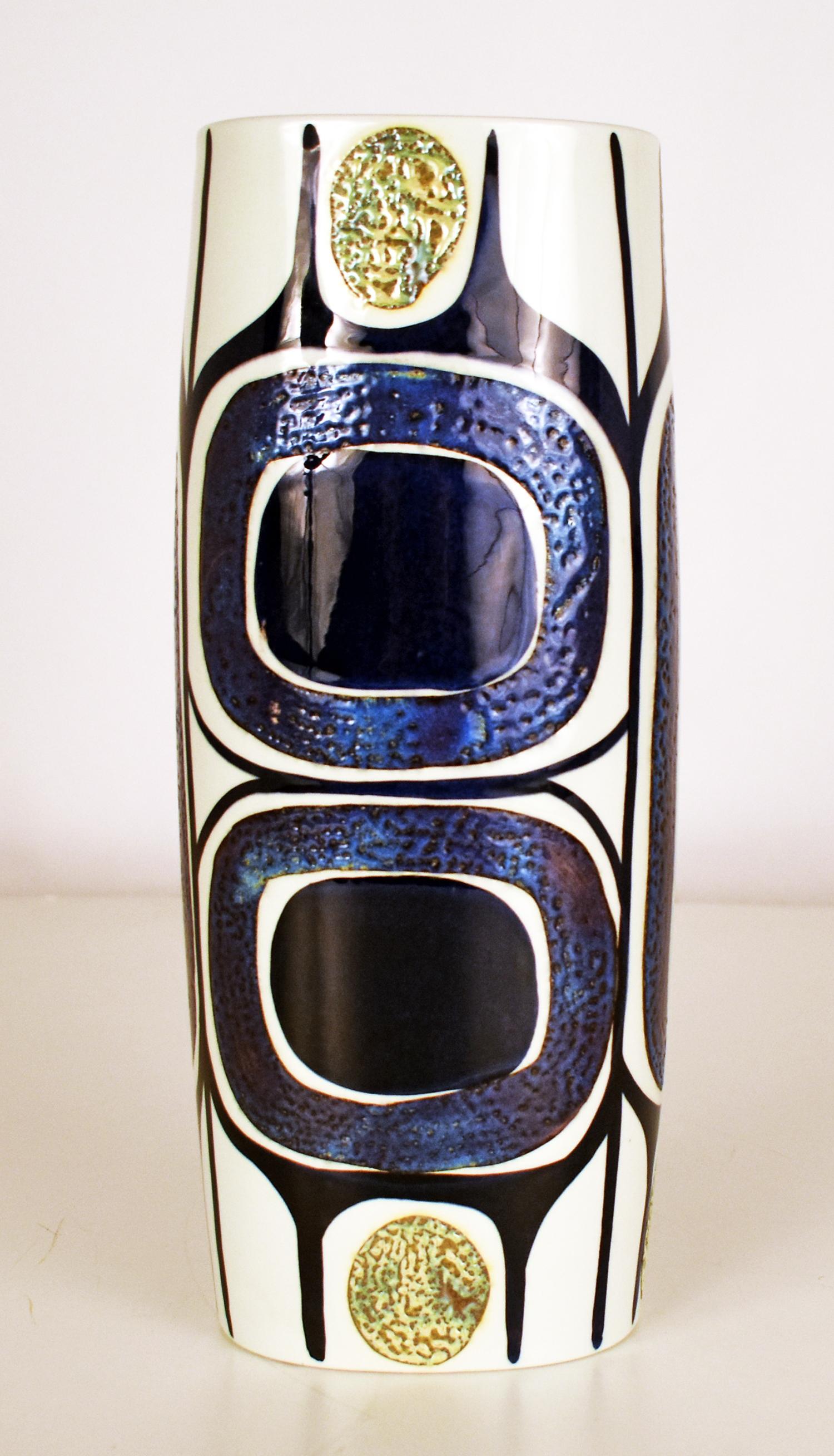 Tall Danish Tenera mid-century vase by Inge-Lise Koefoed for Royal Copenhagen
Tall and eye-catching vase from the Royal Copenhagen Tenera series with gorgeous hand painted decor designed by Inge-Lise Koefoed.
Patterns: Abstract, Geometric
The