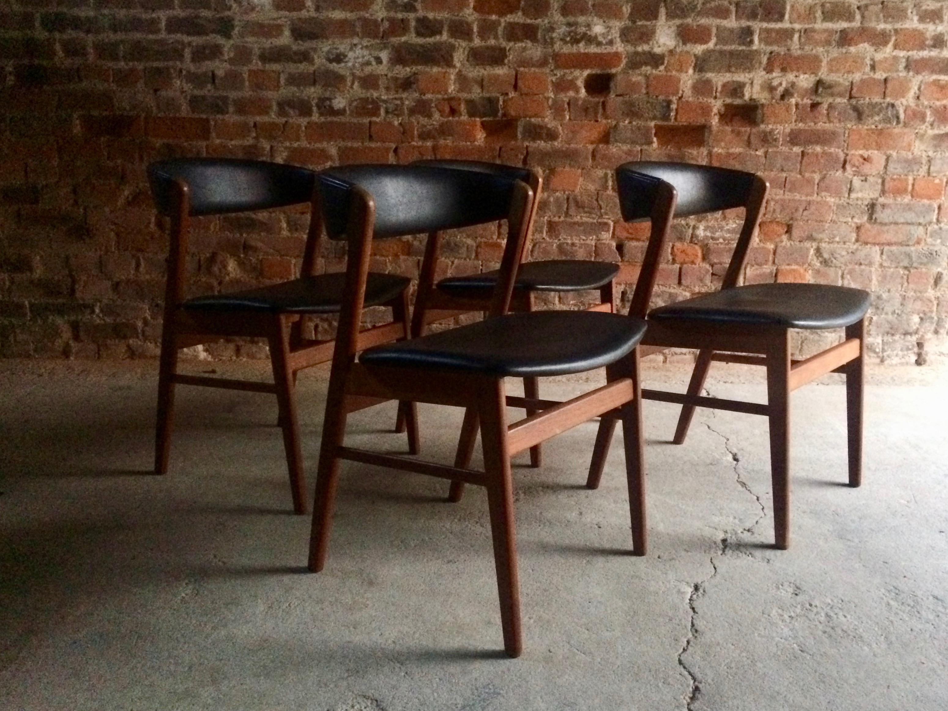Midcentury Danish made set of four solid teak dining chairs by Saxkjøbing Savvaerk Stolefabrik circa 1970 fabulous sculptured teak frames, upholstered black vinyl, with feature rounded seat backs, makers stamp present, SAX made in Denmark. 

