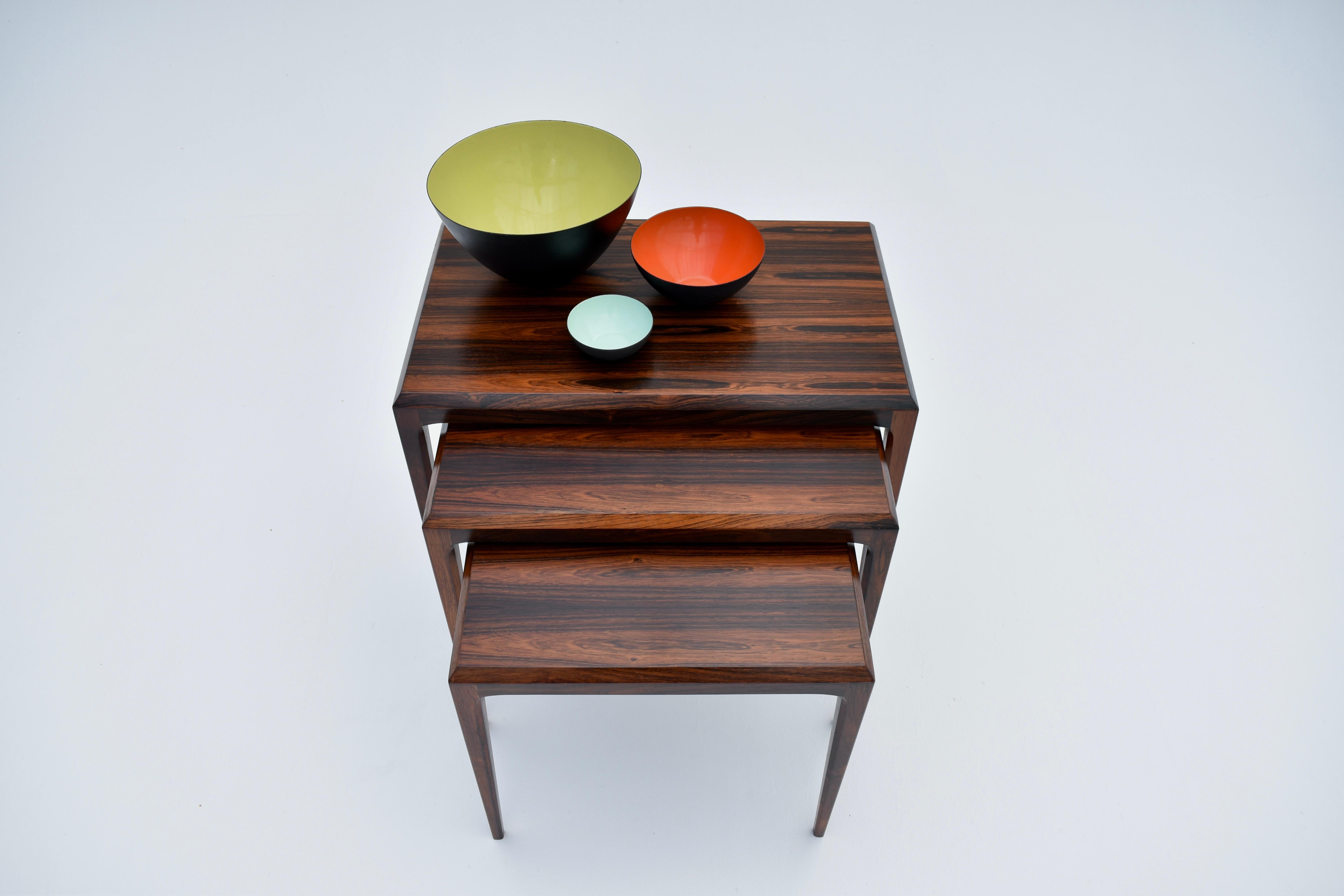 A very attractive set of three nesting side tables designed in the early 60’s by Johannes Andersen for CFC Mobelfabrik.

Incredibly elegant form standing on beautifully tapered legs and a chamfered edge detail to the surface. One of the prettiest 