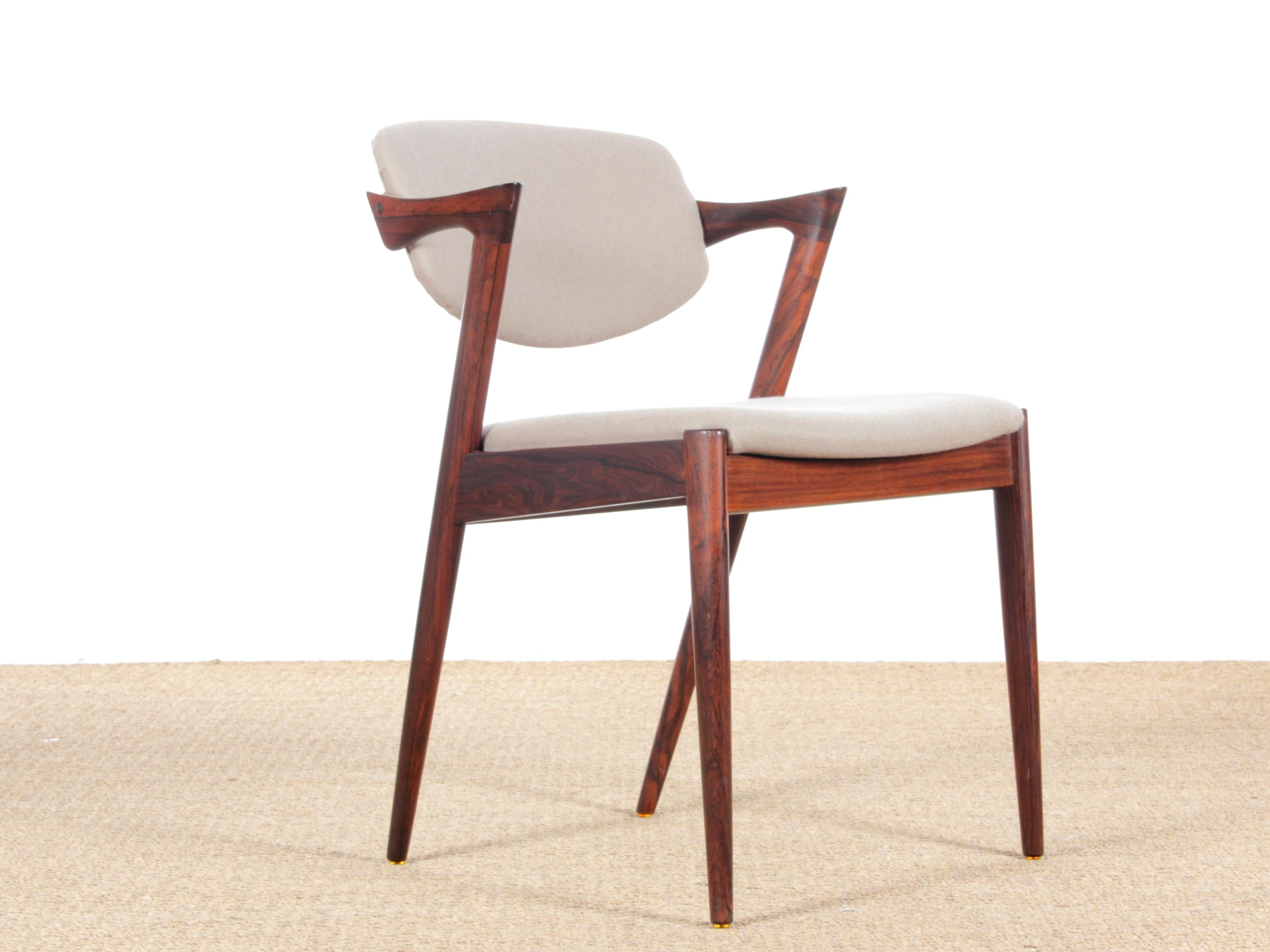 Midcentury Danish set of 8 Kai Kristiansen rosewood chairs, model 42. Newly reupholstered with Camira Blazer fabric color CUZ14. Referenced by the Design Museum Danmark under number RP17674. Bibliography: The furniture fair Denmark 1963, The Danish